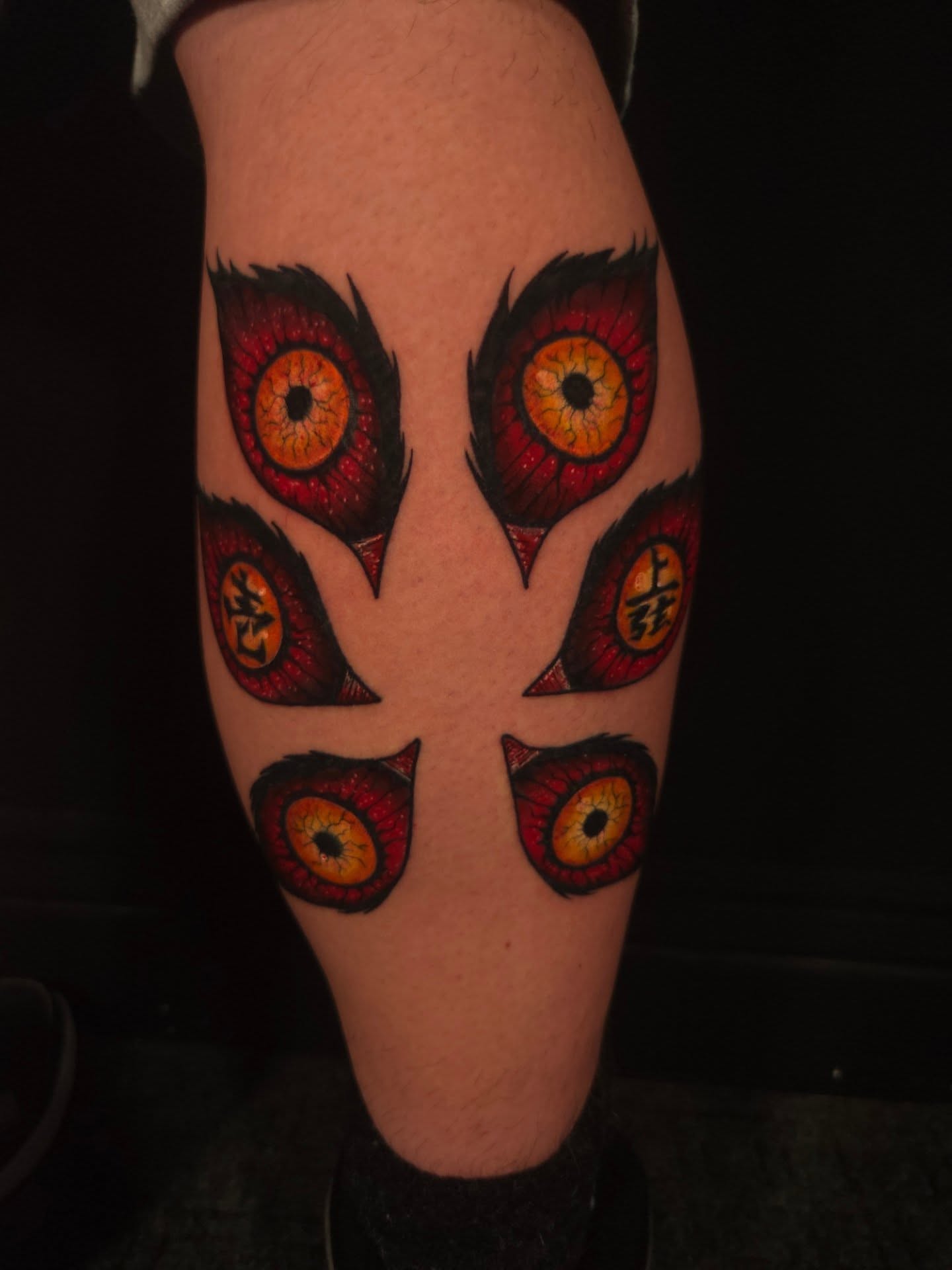 Eyes dotwork tattoo on the leg by Devan Vankirk