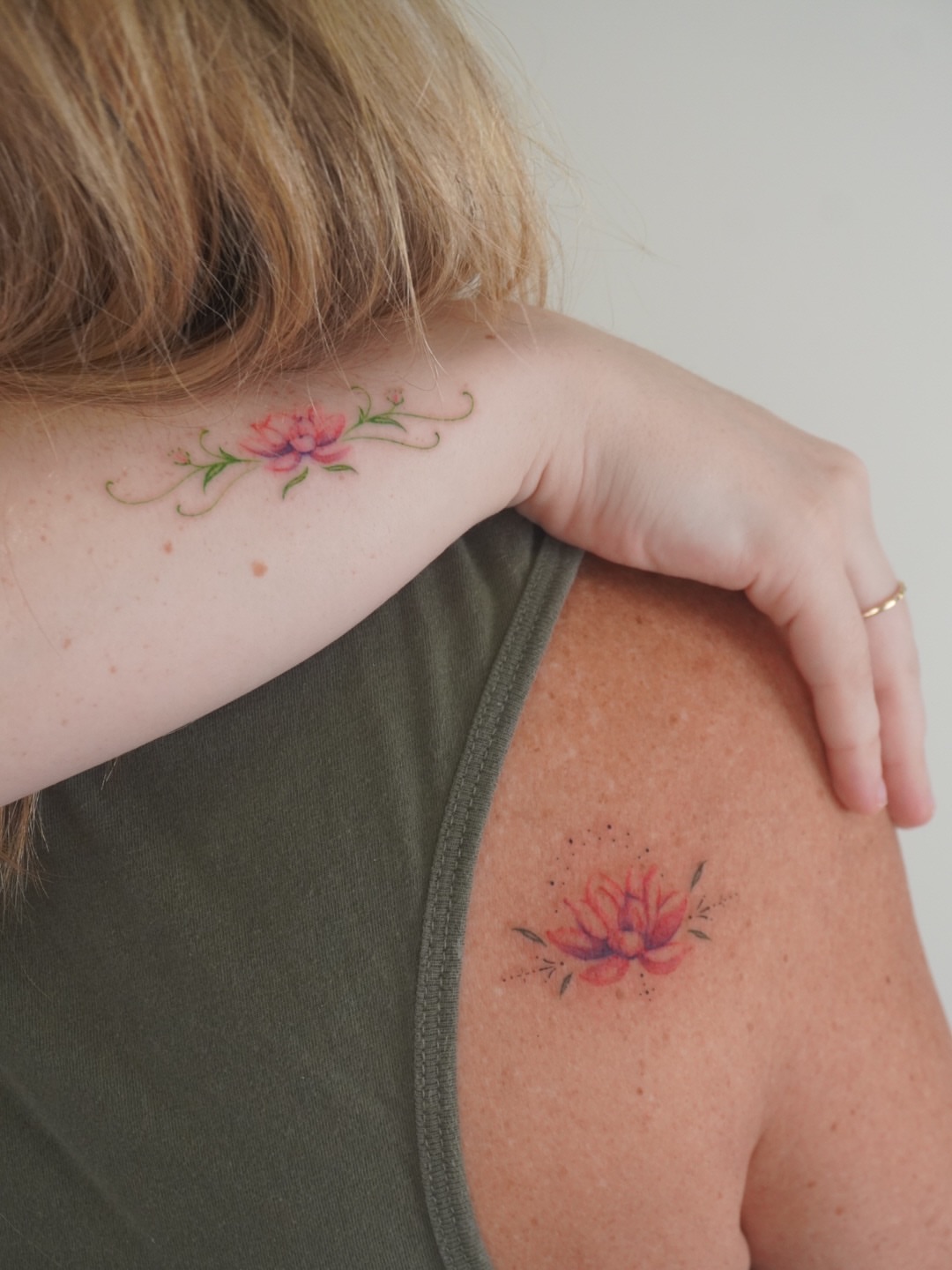 Lotus flower watercolor tattoo on the shoulder by Sun Child Tattoo 🌻