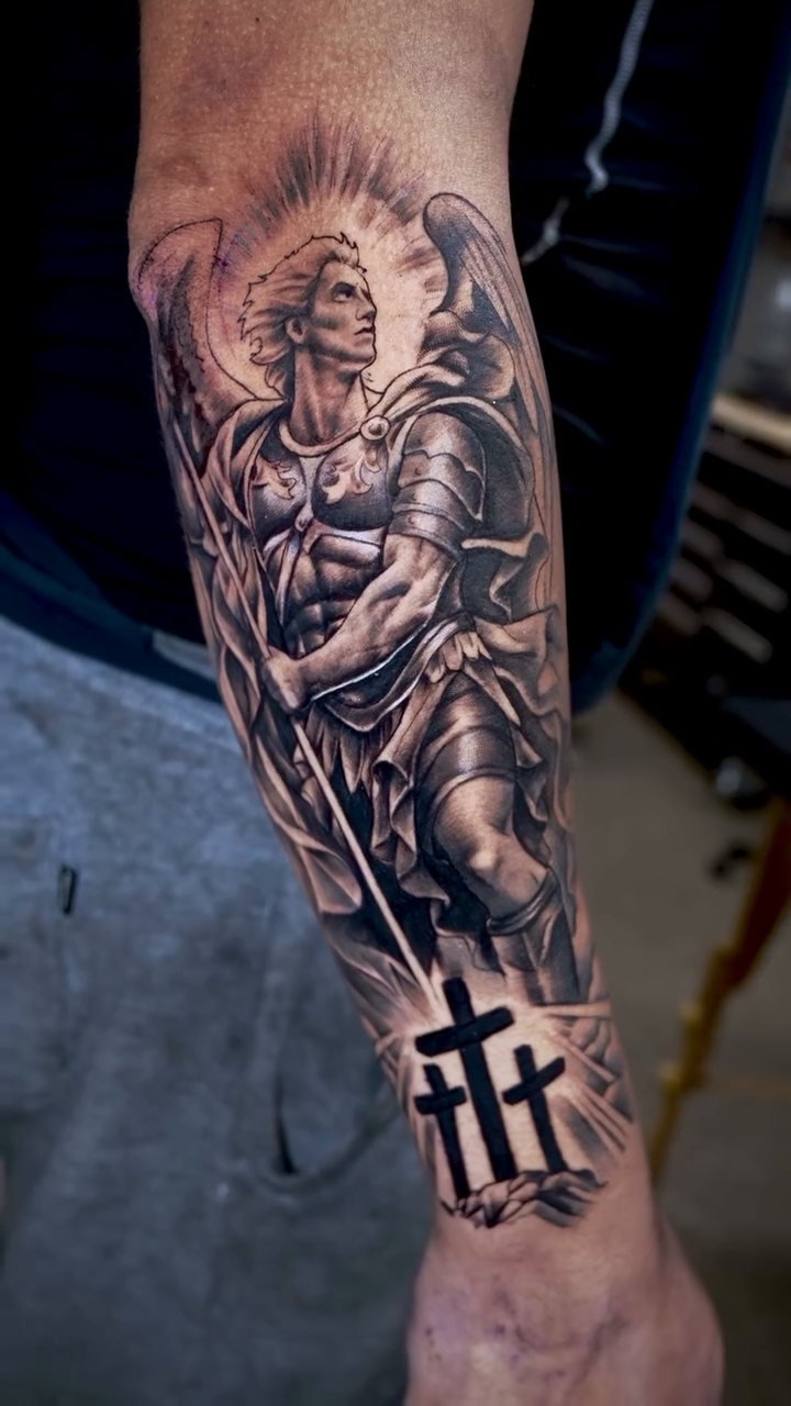 Archangel with crosses realism tattoo by Luis Arenas