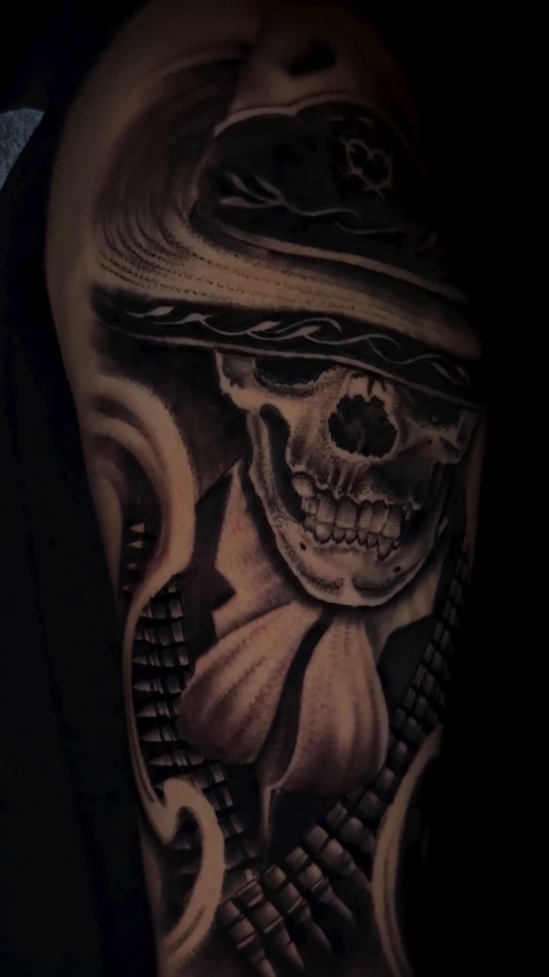 Skull with hat and tie realism tattoo by Henry Fuentes
