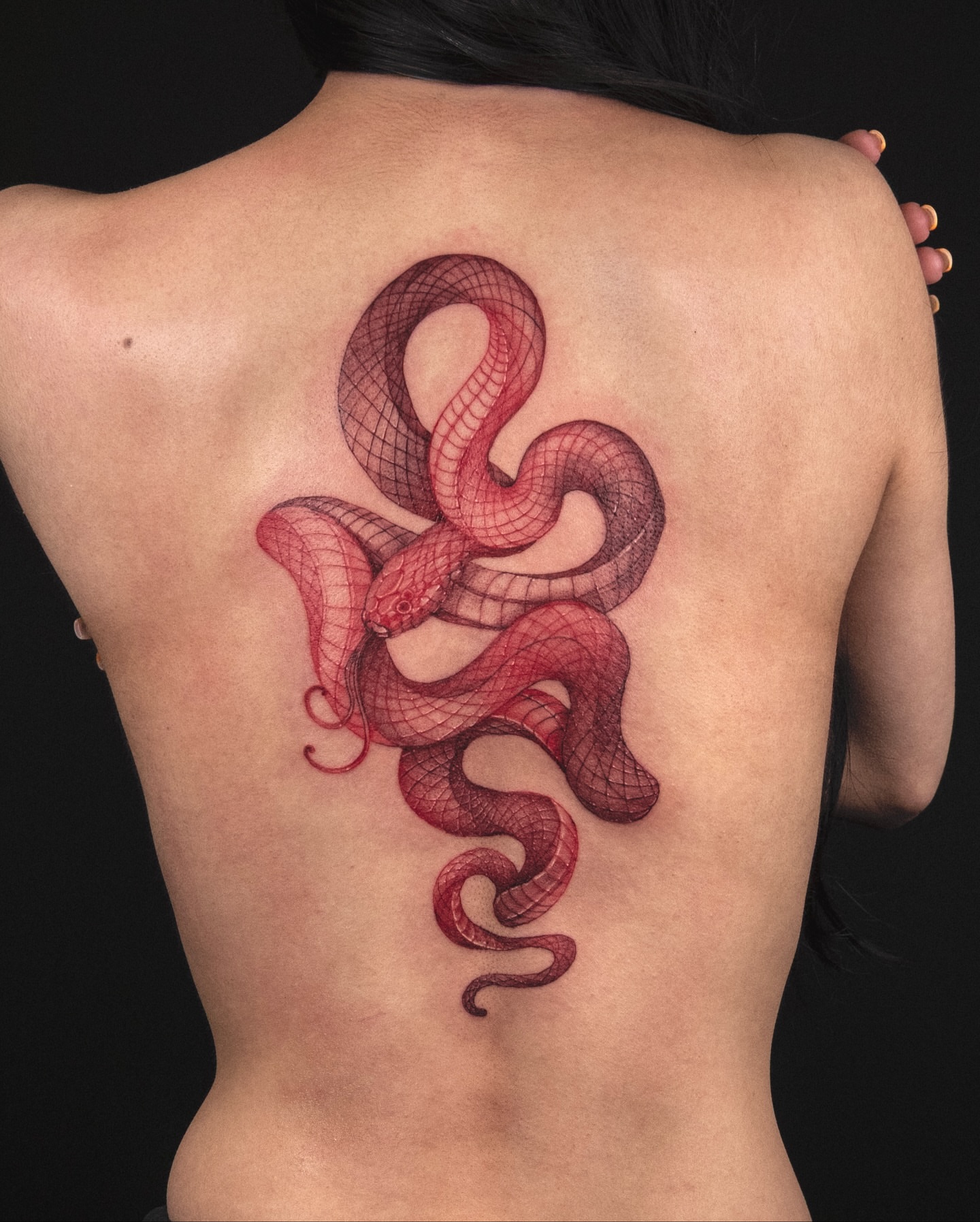 Snakes geometric tattoo on the back by Wong Lee