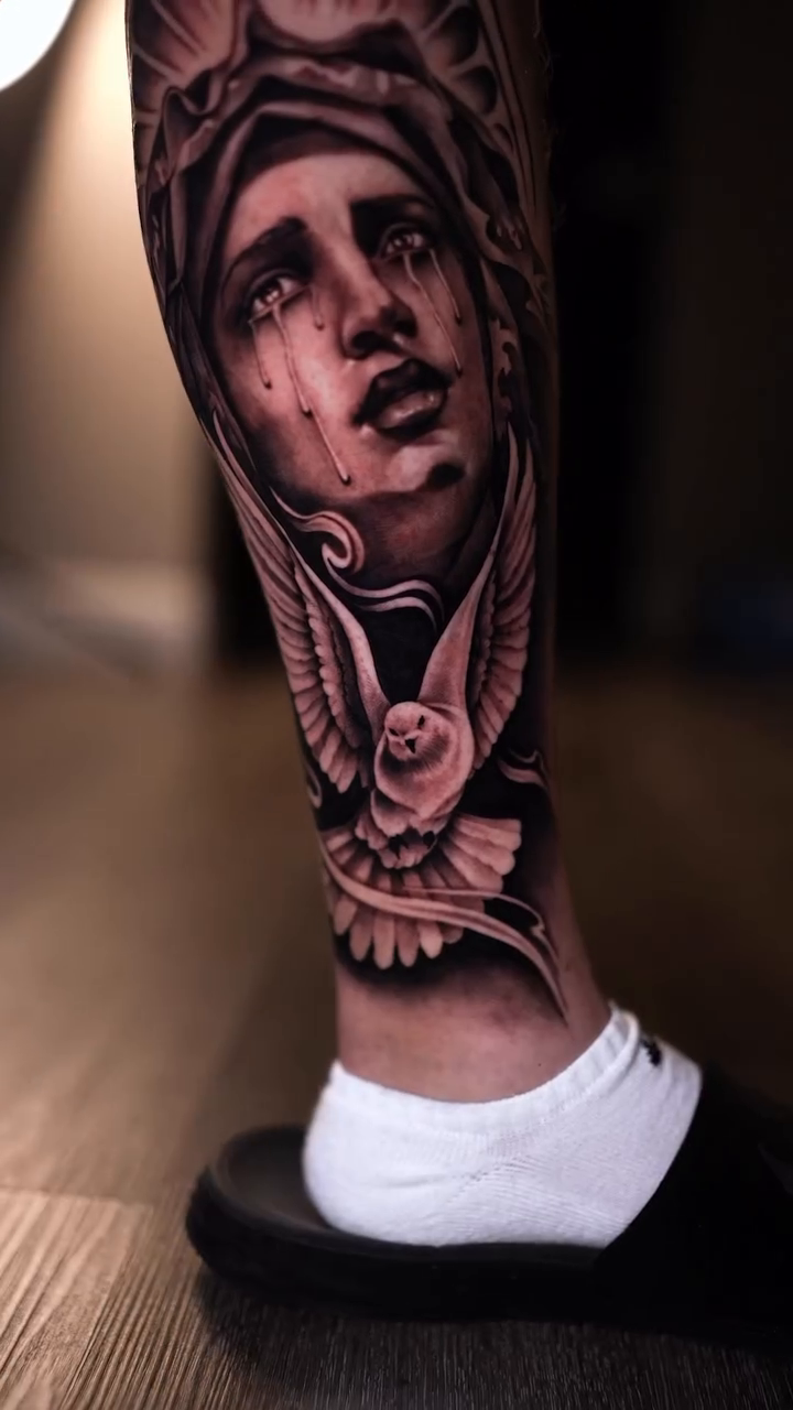 Weeping woman with halo and dove realism tattoo by Esto