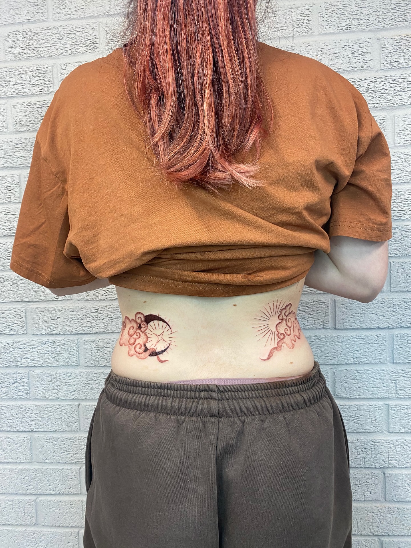 Cat and sun American traditional tattoo on the torso by Ellena Reggiani