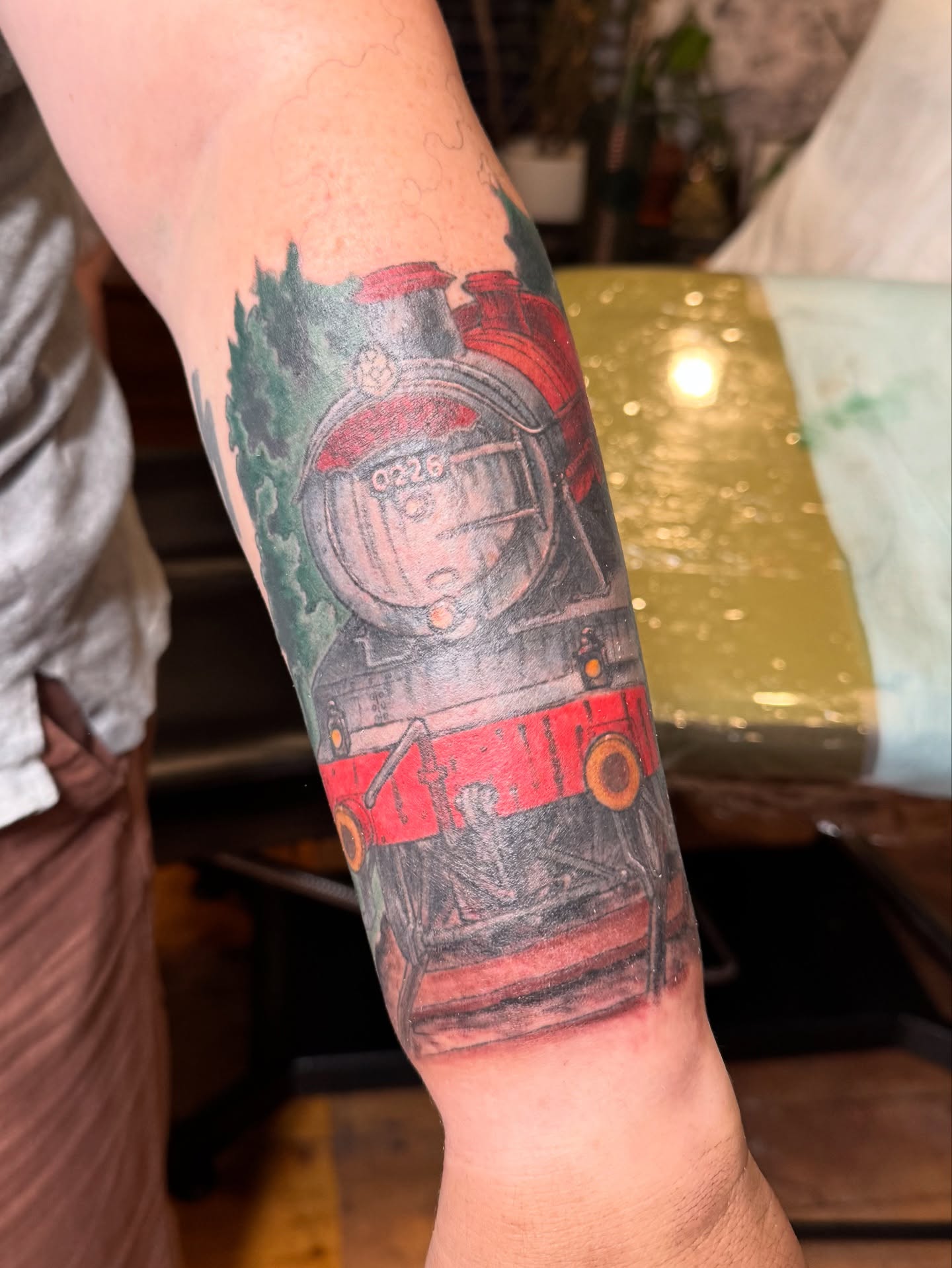 Steam locomotive realism tattoo on the forearm by Rebeka Chase [Sobodacha]
