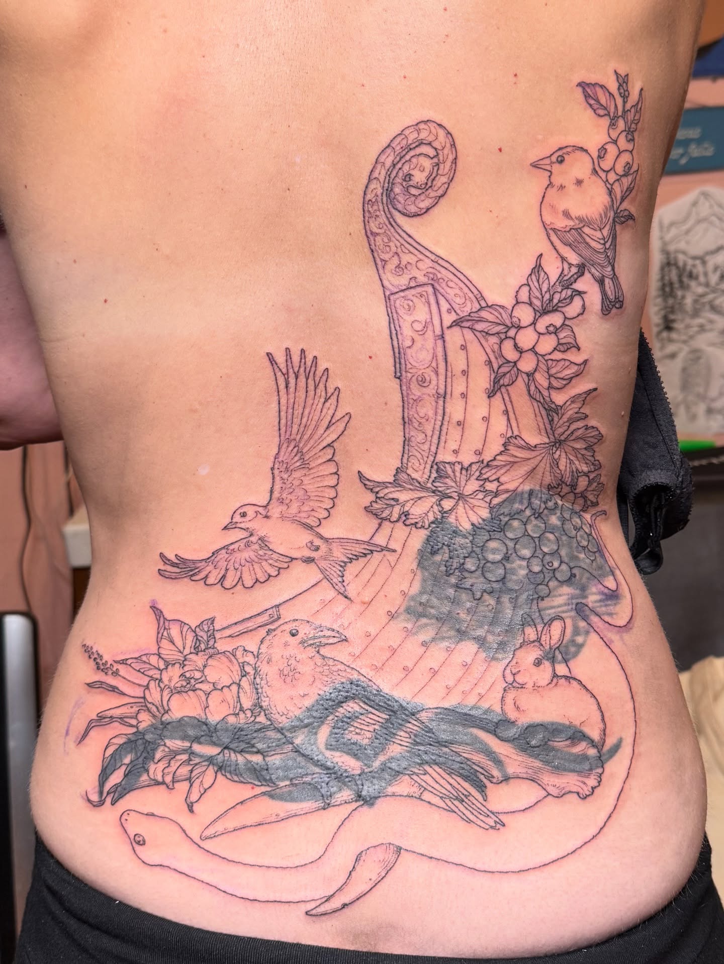 Bird and harp neo-traditional tattoo on the ribs by Rebeka Chase [Sobodacha]