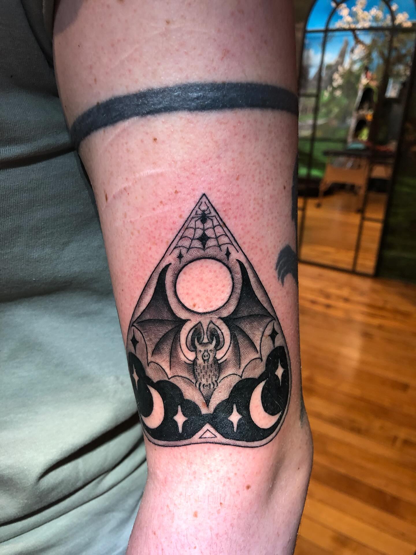 Bat and moon geometric tattoo on the forearm by Lake Stephens, Richmond, Virginia
