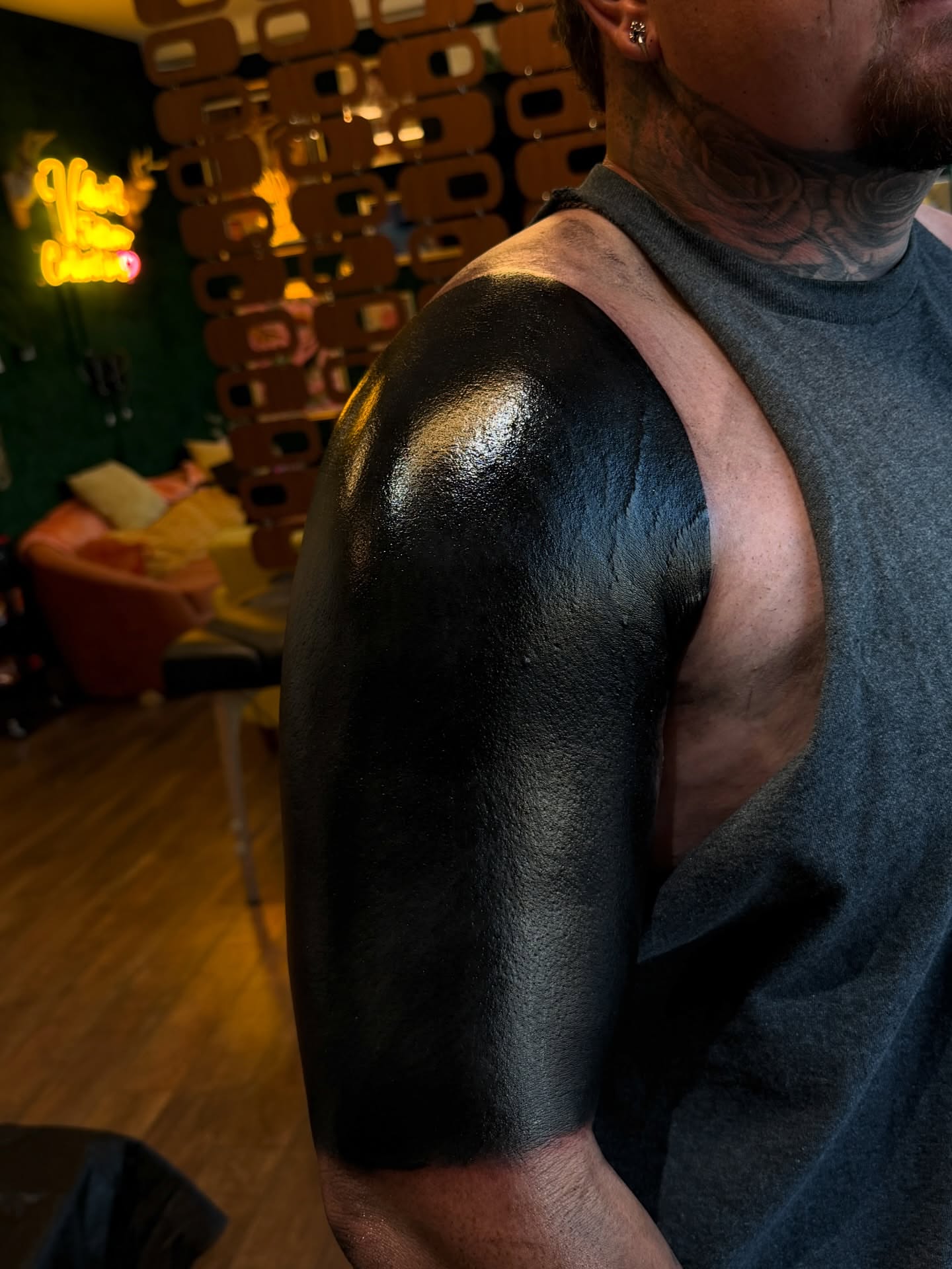 Blackout blackwork tattoo on the upper arm by Denver Blackout Tattoo Specialist - Anthony