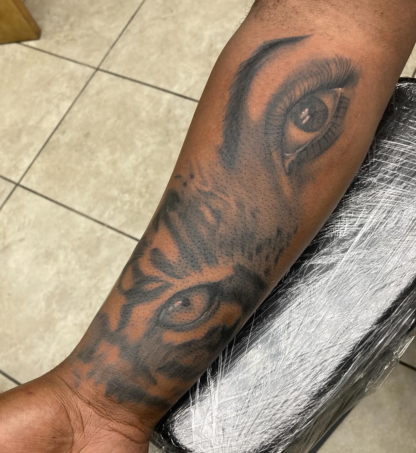 Eye realism tattoo on the forearm by Hot Dawg
