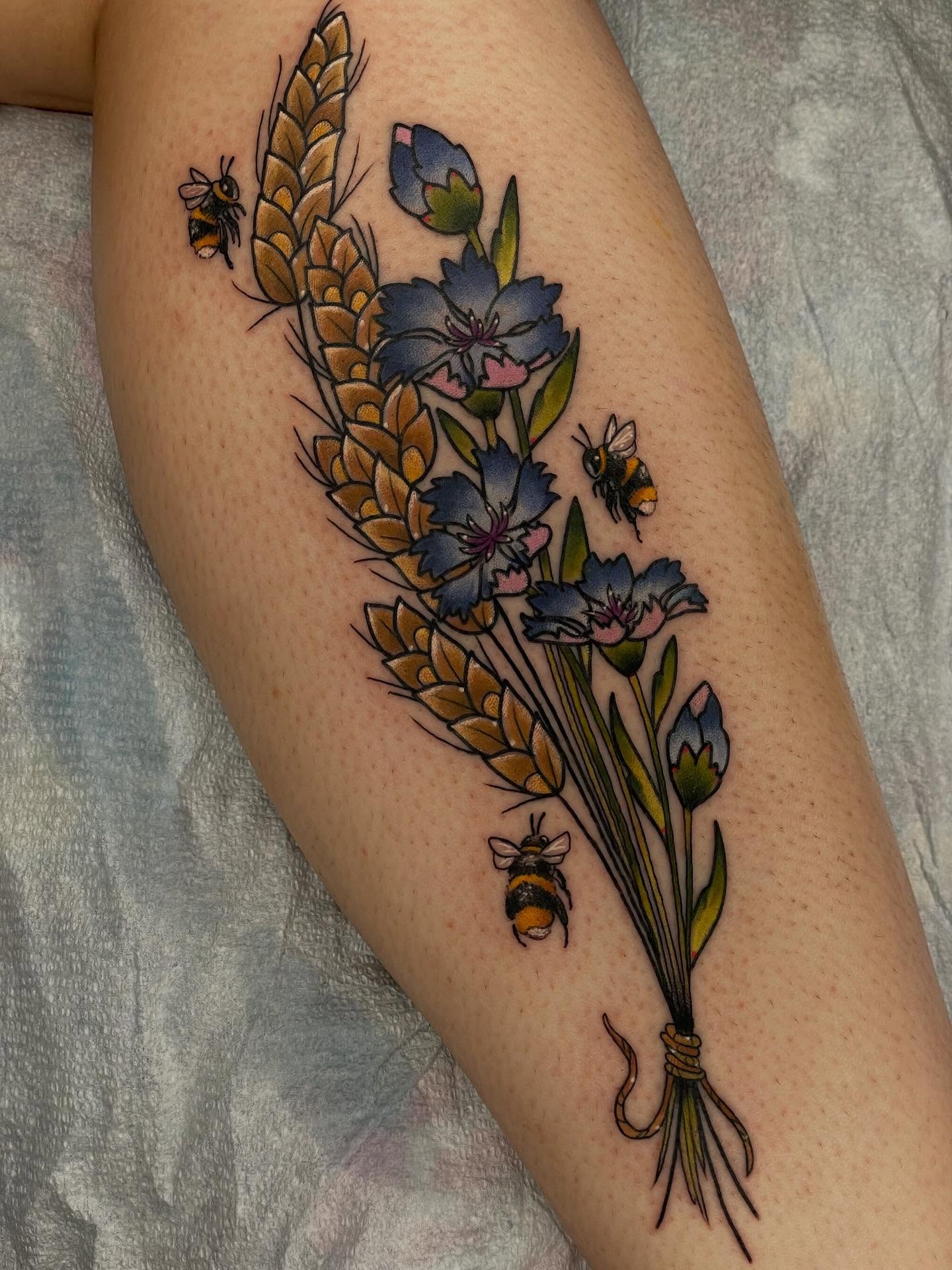 Wheat bouquet with bees new school tattoo on the thigh by Beeker, Bellingham, Washington