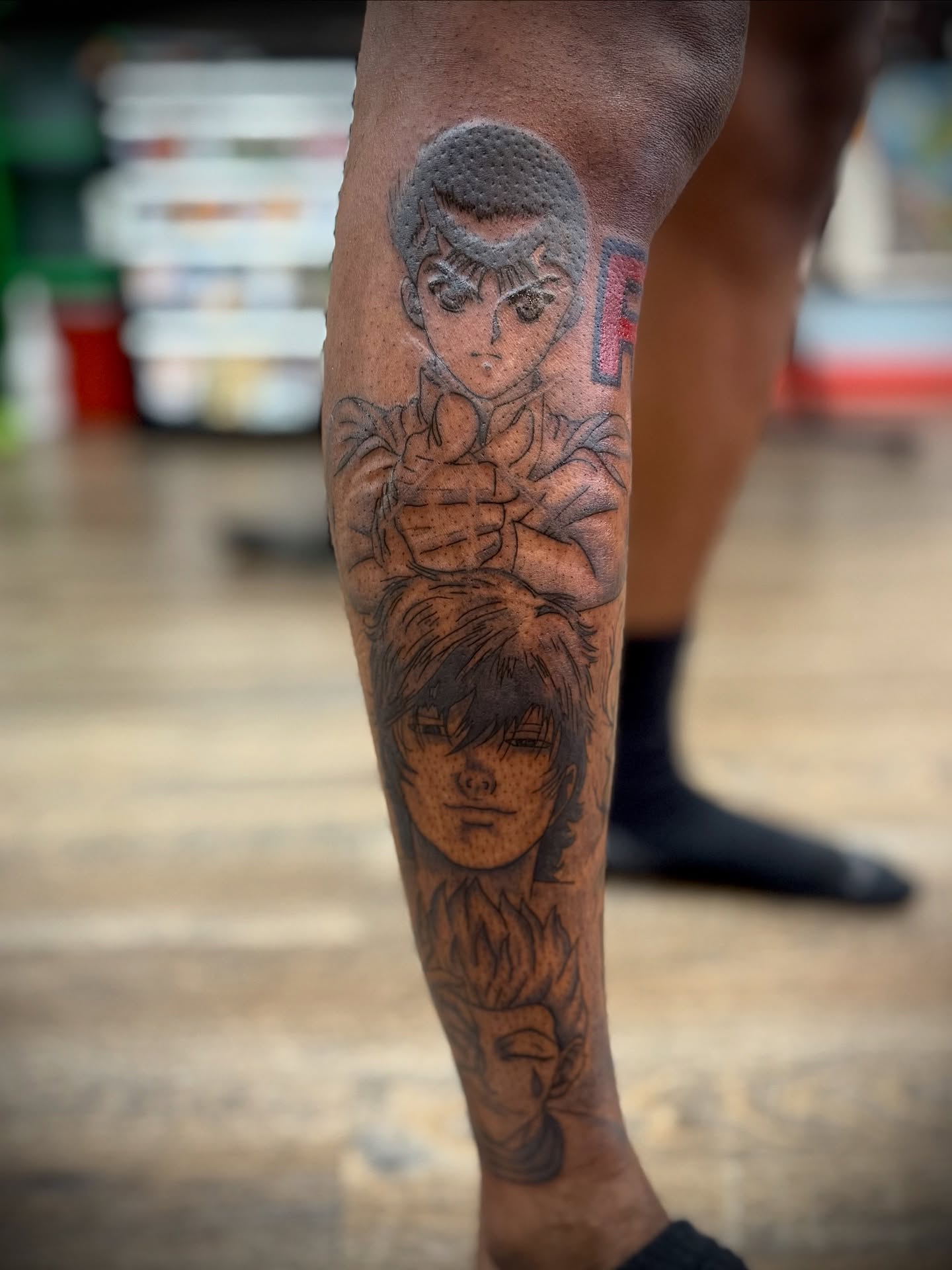 Anime characters anime tattoo on the forearm by Justin Bianchini - New Orleans Tattoo Artist