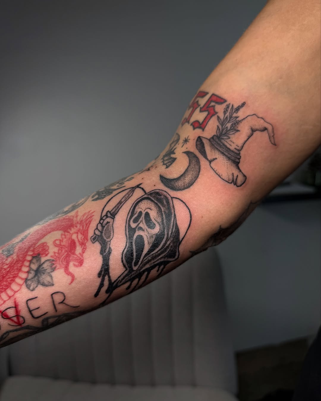 Scream mask with knife realism tattoo on the forearm by Victoria