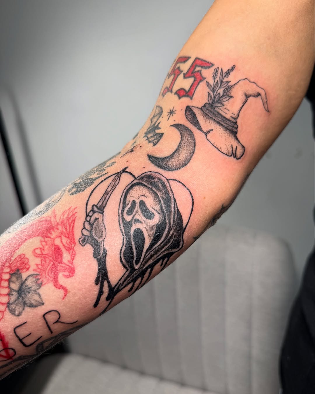 Ghostface mask with knife realism tattoo on the forearm by Victoria