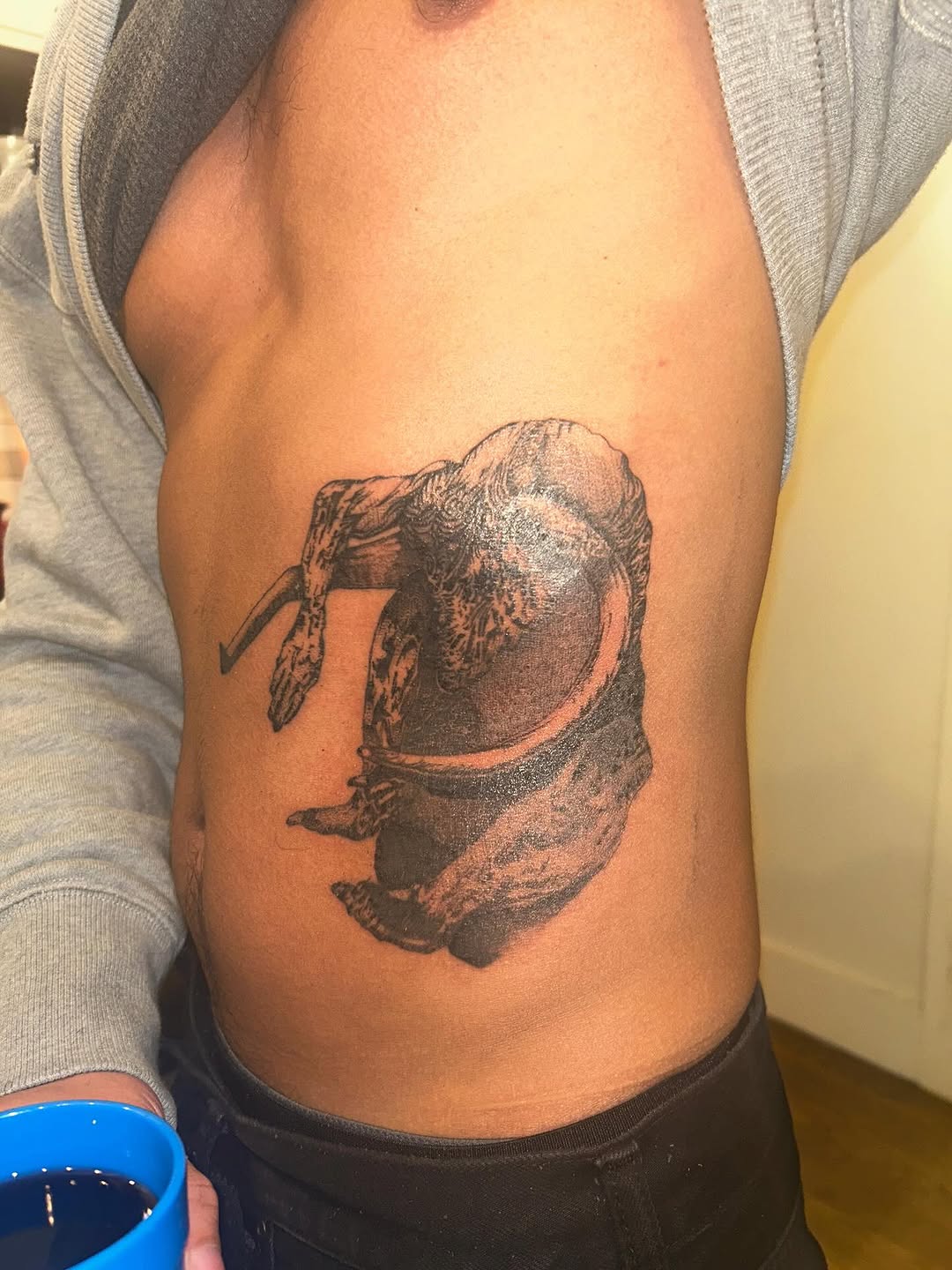 Creature portrait surrealism tattoo on the ribs by Jadin Nichols