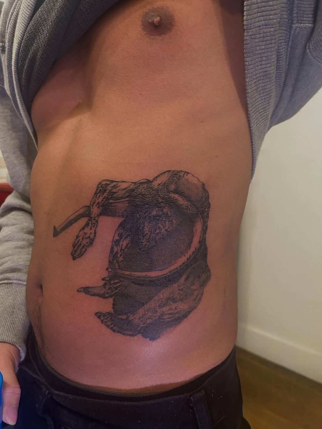 Creature head realism tattoo on the ribs by Jadin Nichols