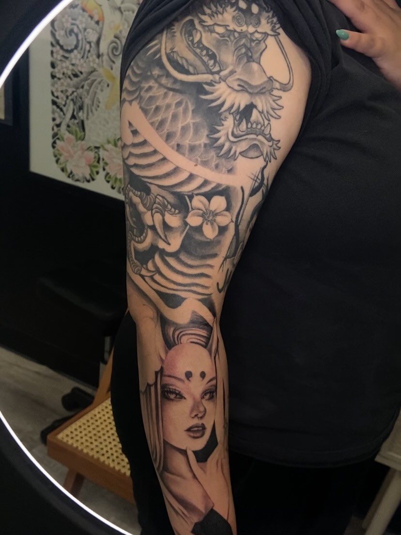 Dragon and woman realism tattoo on the upper arm by Las Vegas Tattoo Artist π€ Nani