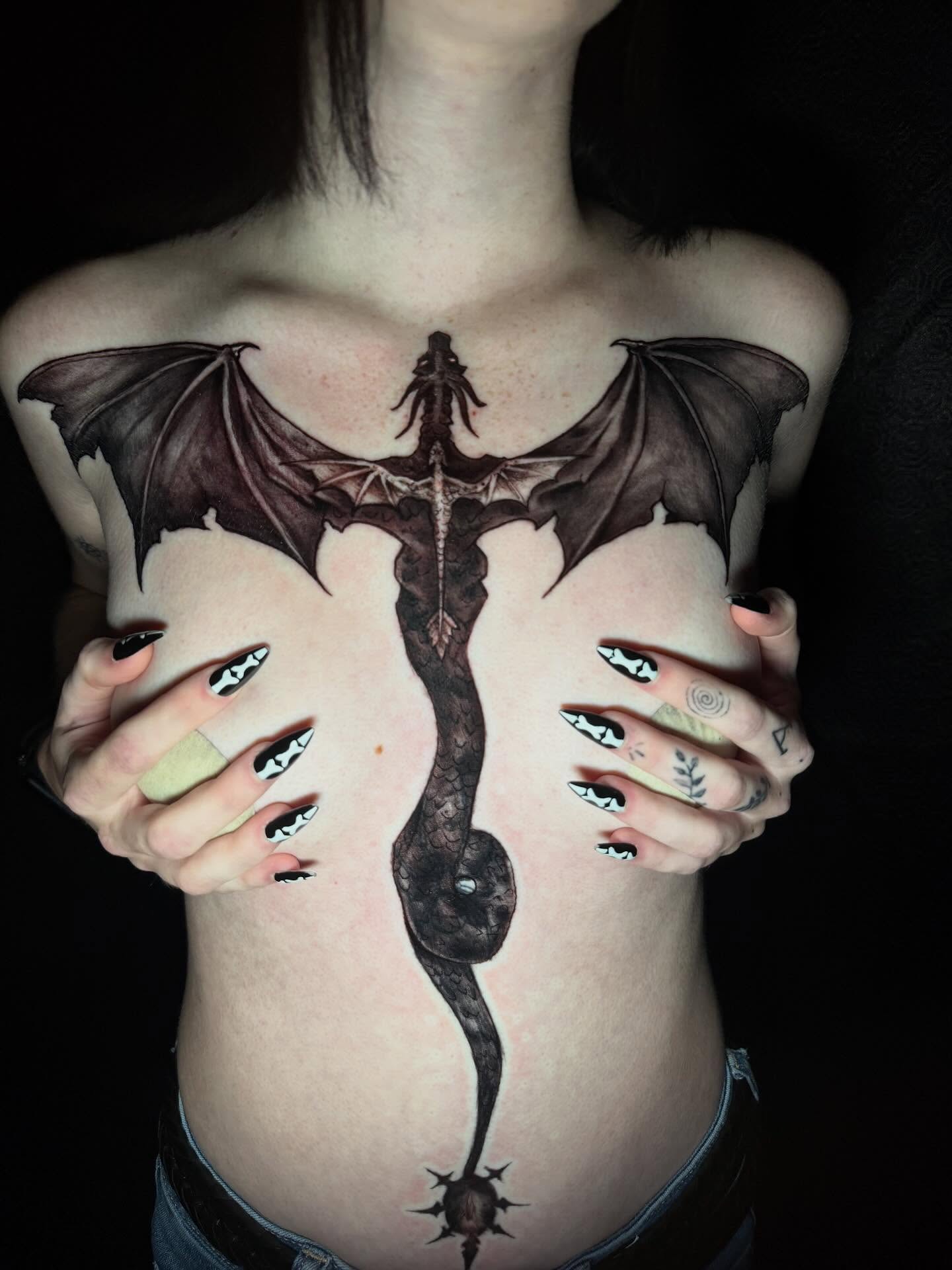 Dragon realism tattoo on the chest by Skunk Punk