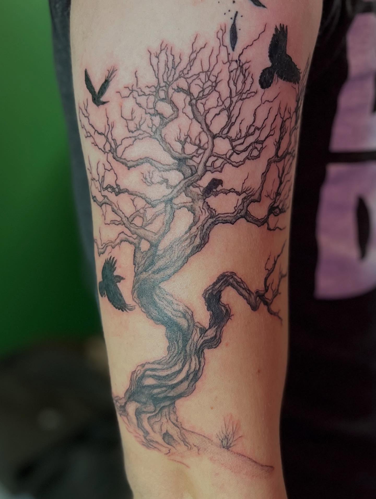 Tree with birds black and grey tattoo on the forearm by Caitlin, Richmond, Virginia