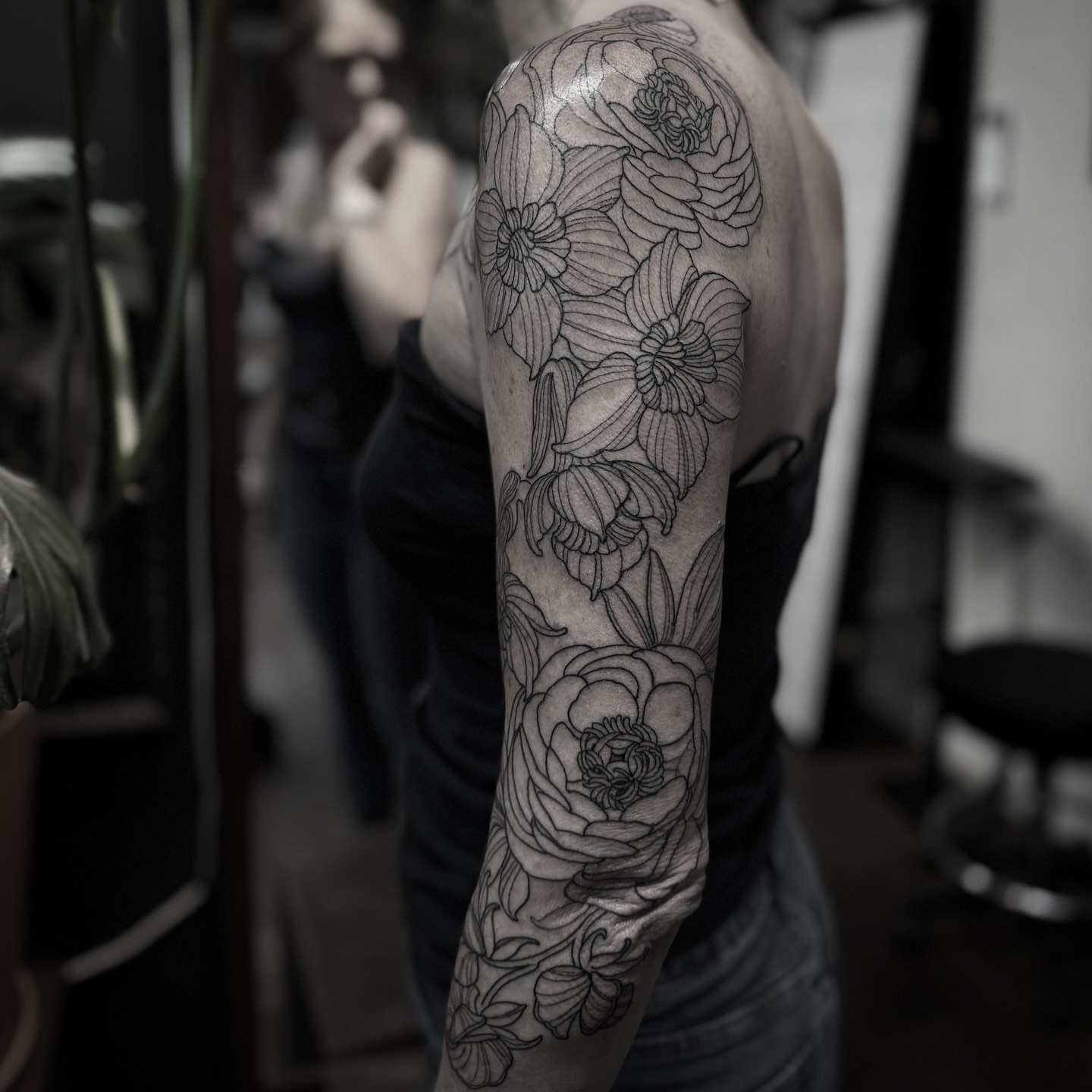 Floral bouquet black and grey tattoo on the forearm by gina