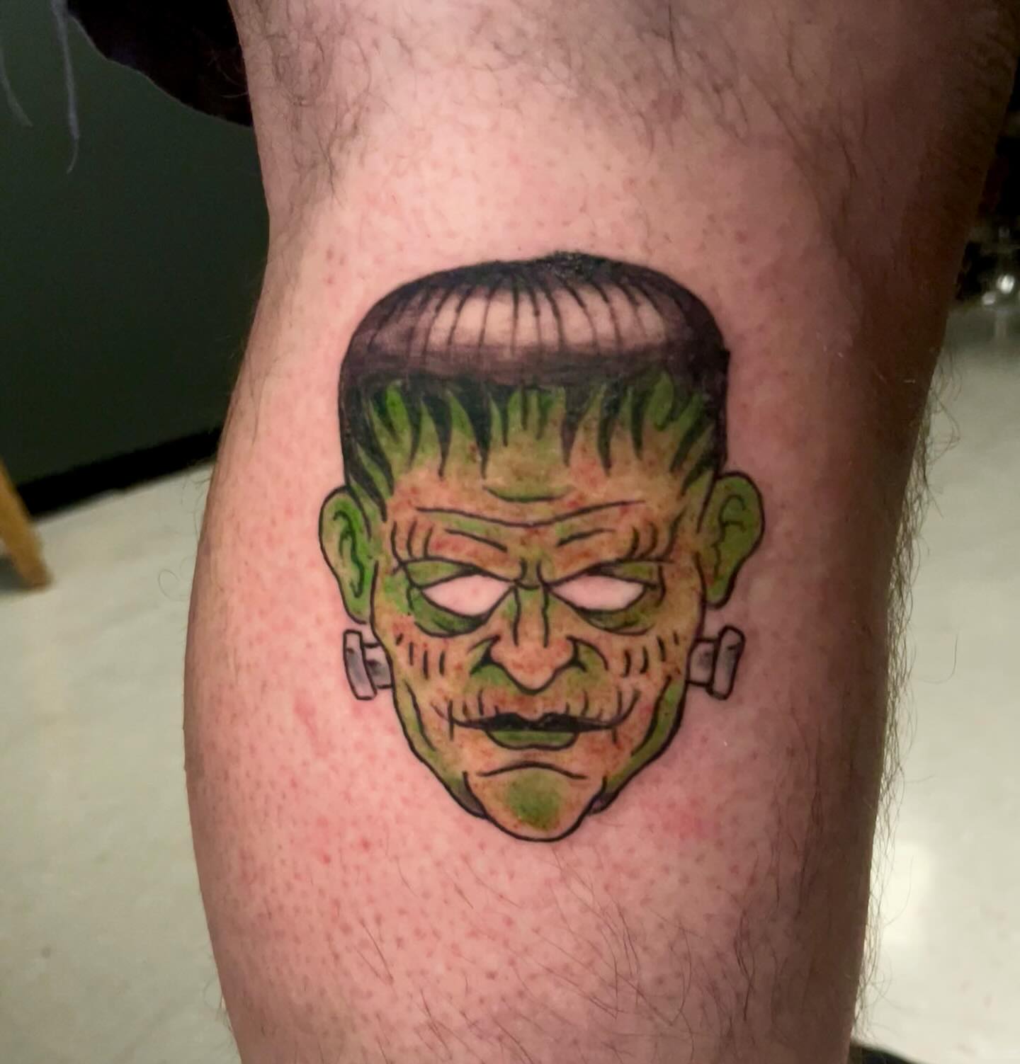 Frankenstein American traditional tattoo on the thigh by Logan Casimir