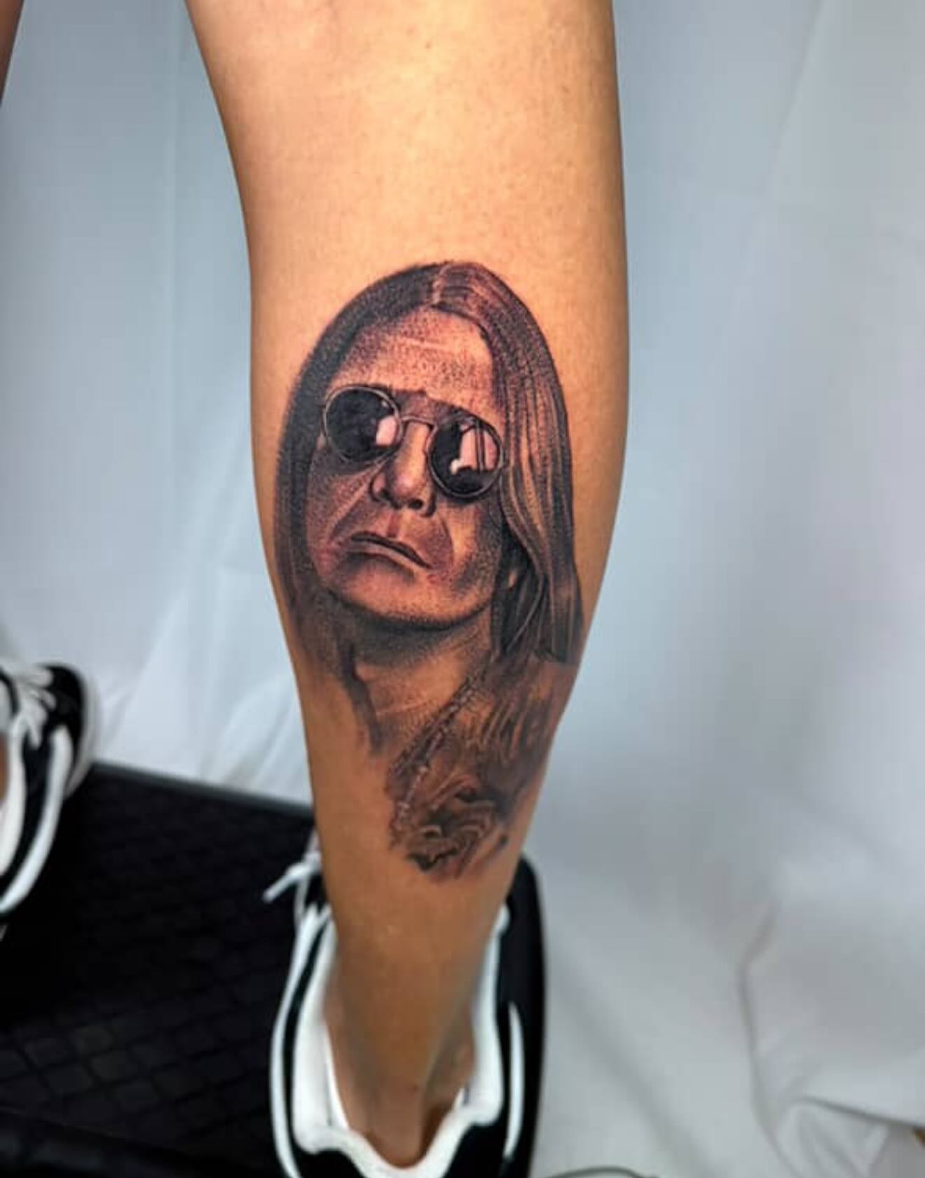 Portrait realism tattoo on the forearm by Jared Soto