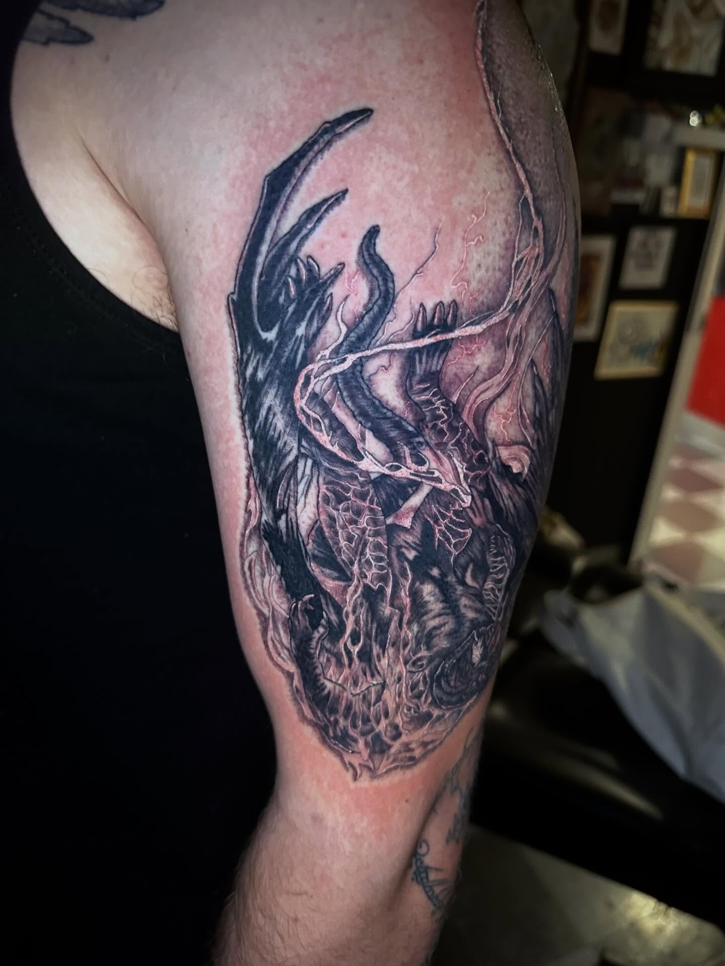 Dragon realism tattoo on the forearm by Sierra