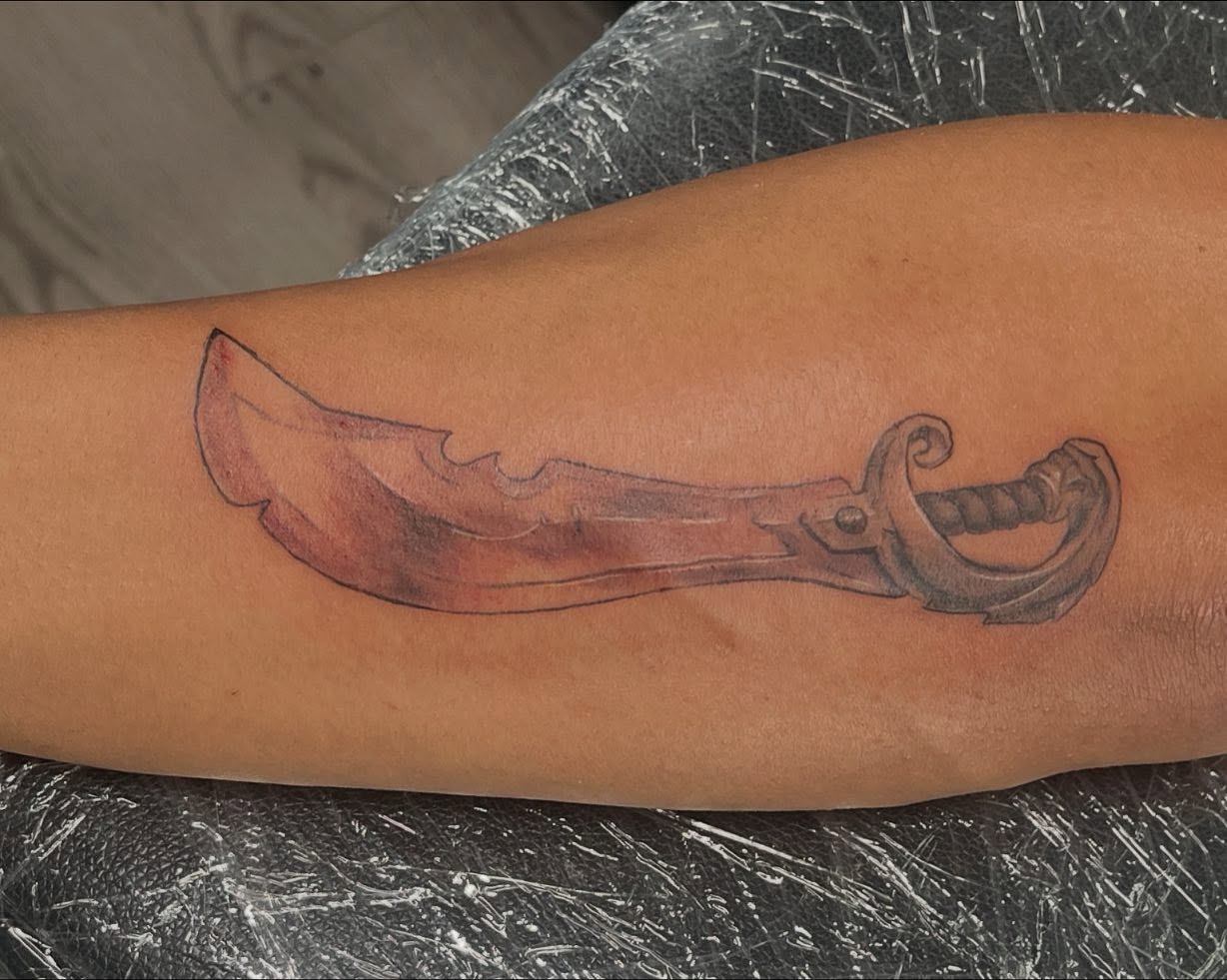 Knife black and grey tattoo on the forearm by Kevin, Las Vegas, Nevada