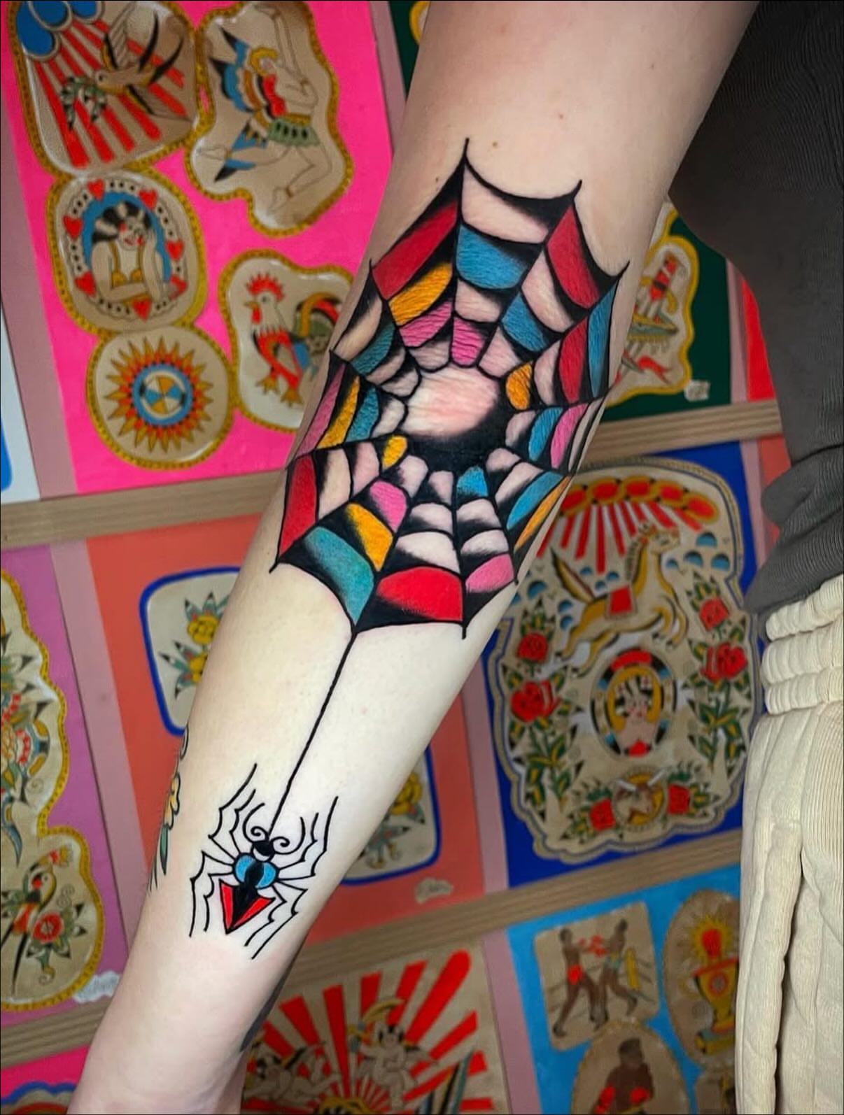 Spider web American traditional tattoo on the forearm by Britt Kuechenmeister, Culver City, California