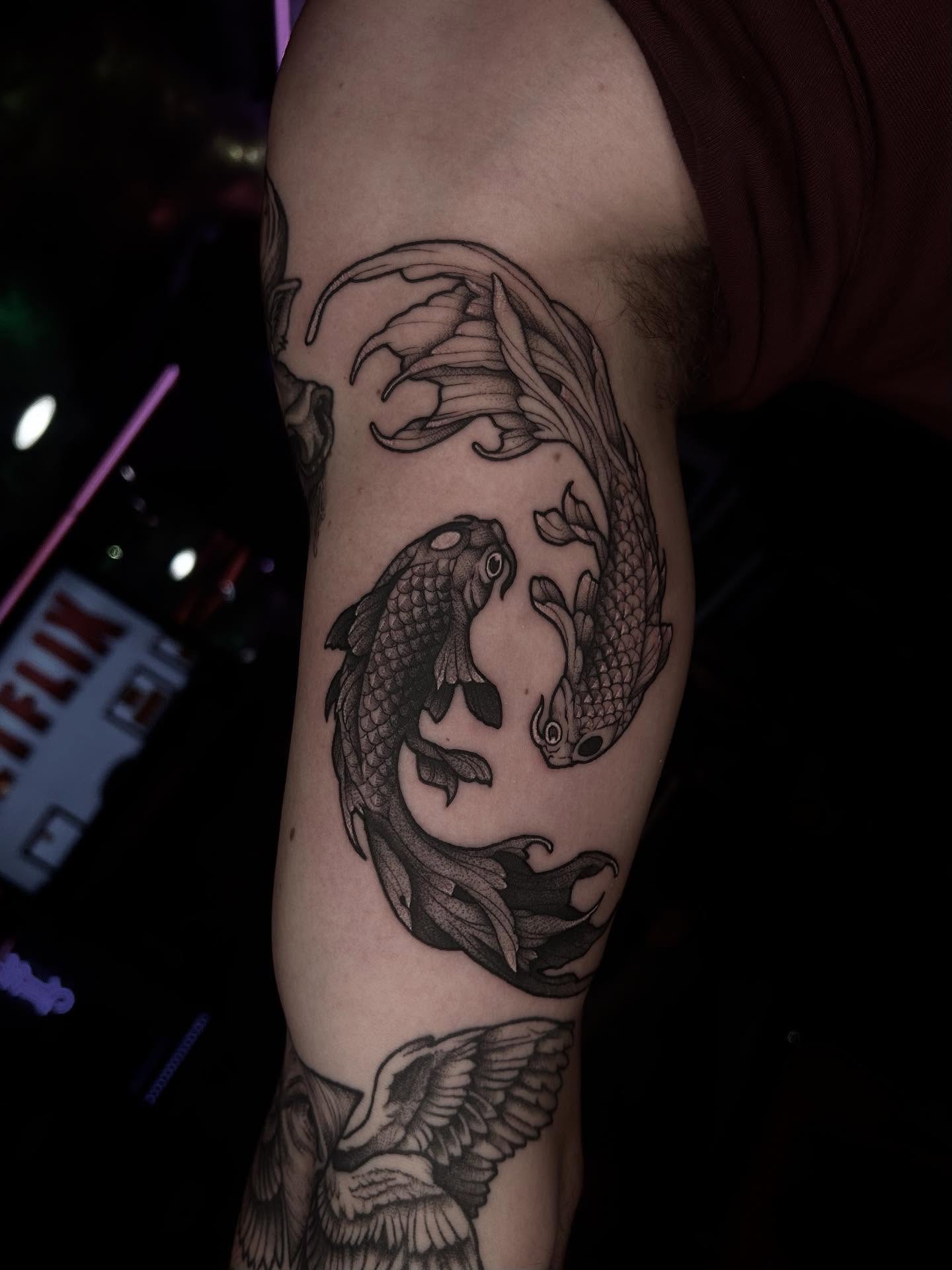 Koi fish black and grey tattoo on the forearm by Tattoos by Abbey