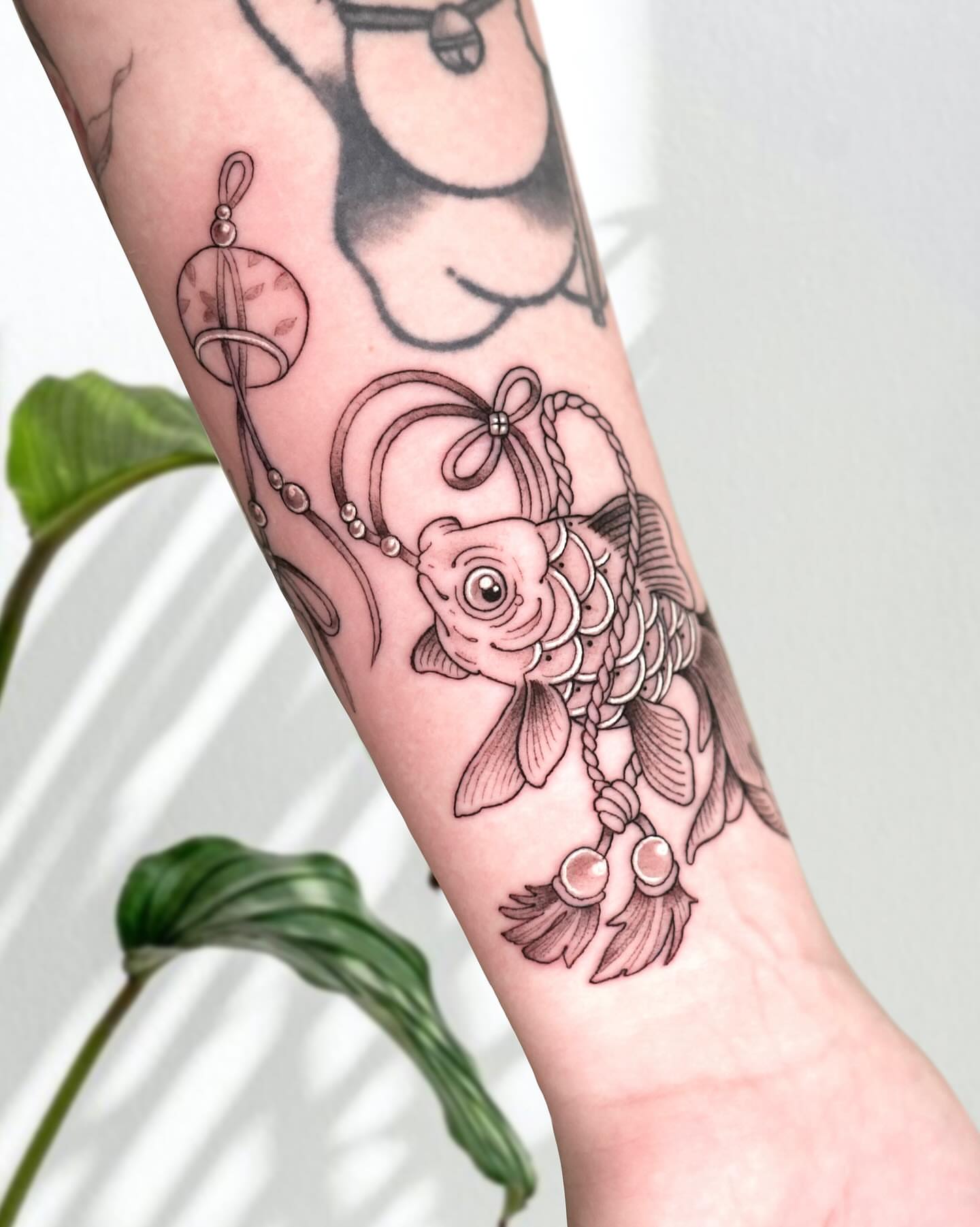 Koi fish black and grey tattoo on the forearm by Marianna D D King