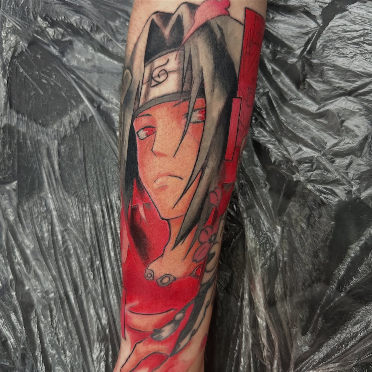 Anime character anime tattoo on the forearm by Trent Hebert