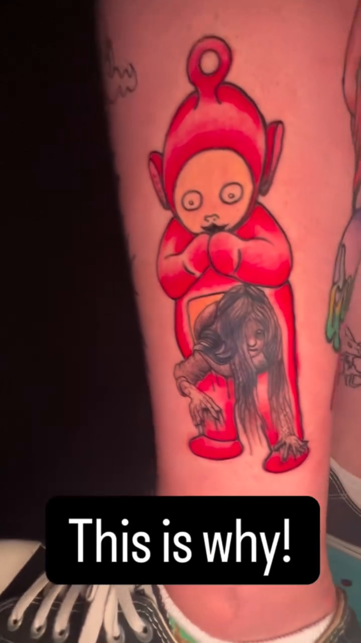 Teletubby holding a decaying figure ignorant tattoo on the leg by Davidsteeletattoos, Dallas, Texas