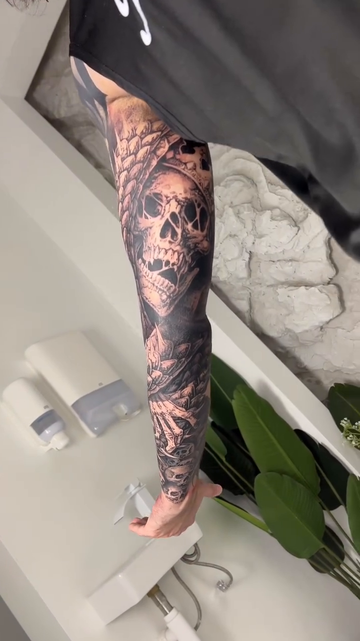 Skull and octopus sleeve dark realism tattoo by Hollow Priest