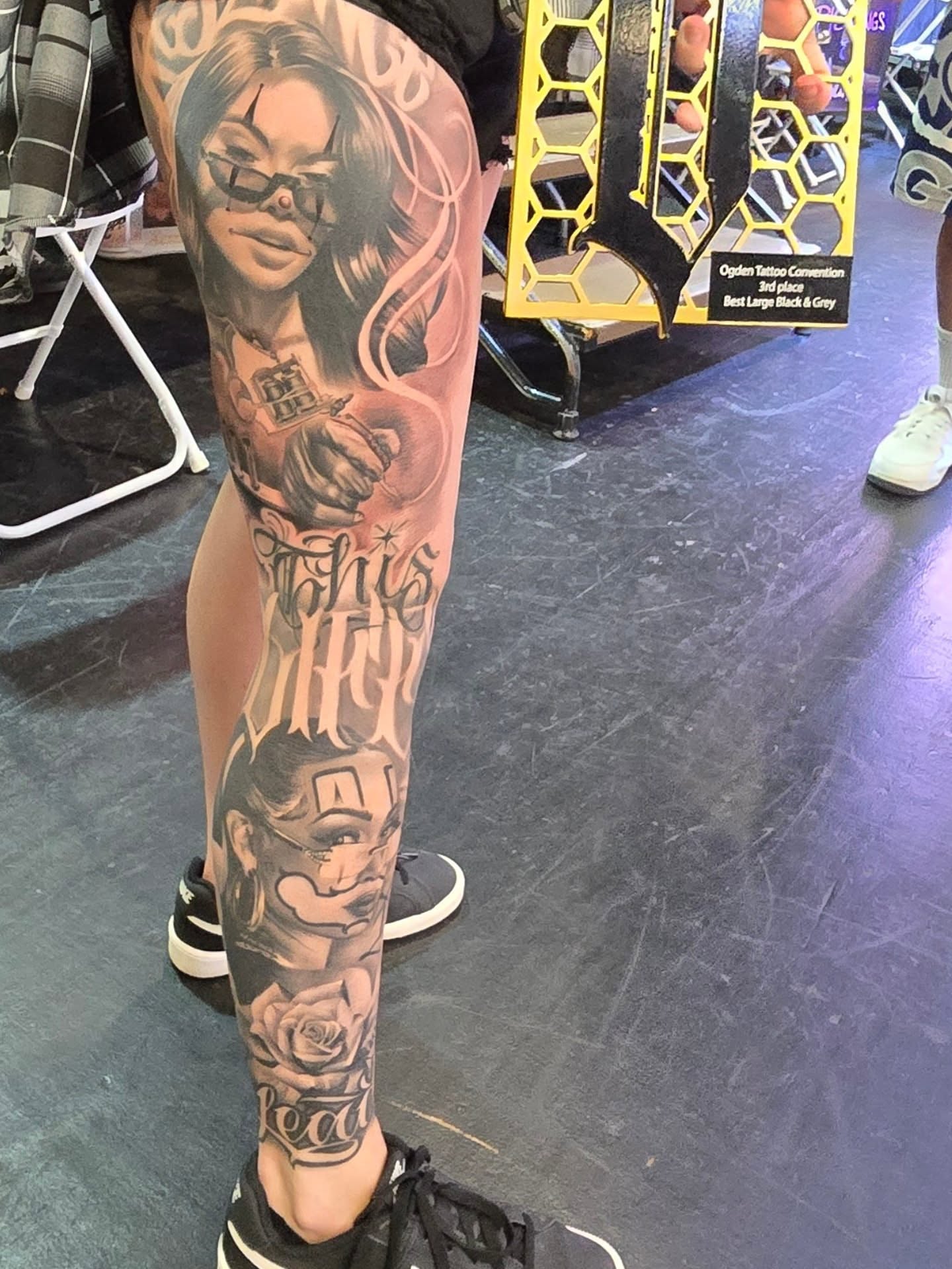 Woman with gun realism tattoo on the leg by Jack Daniel Knowlden