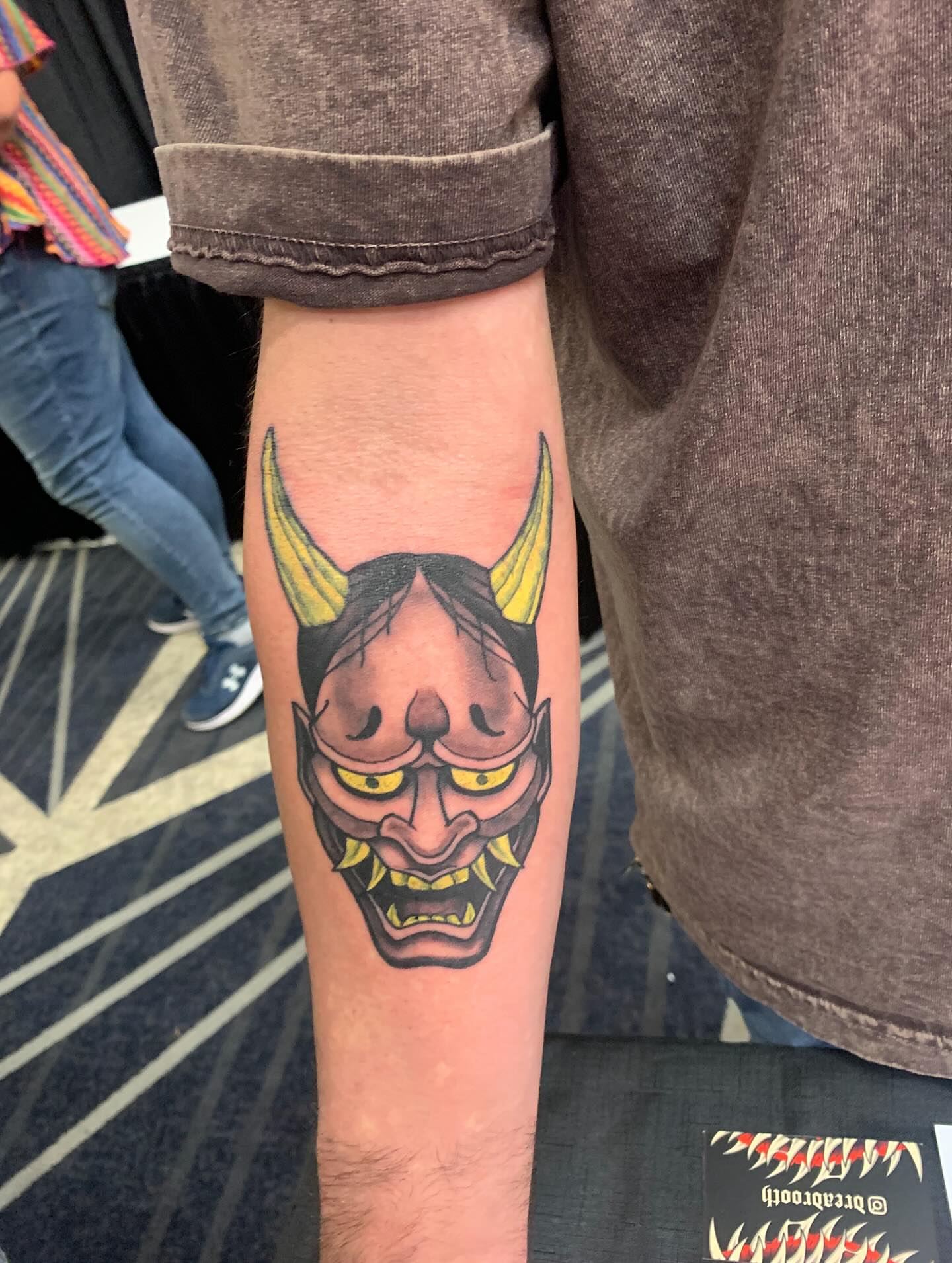 Demon mask American traditional tattoo on the forearm by Devon
