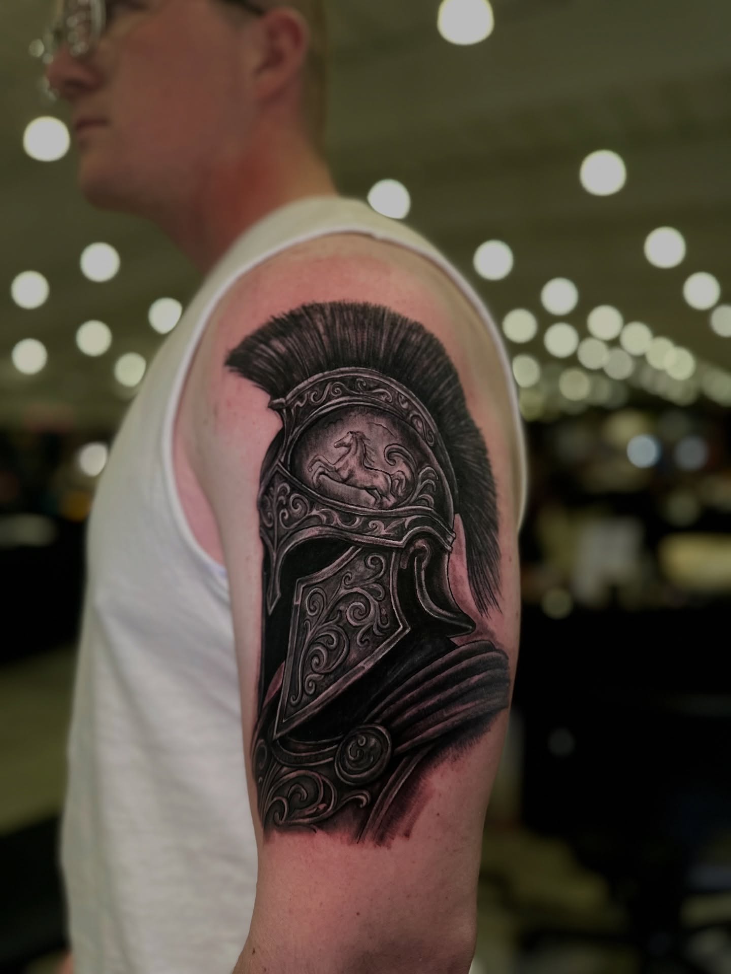 Helmet realism tattoo on the forearm by Héctor Agudelo