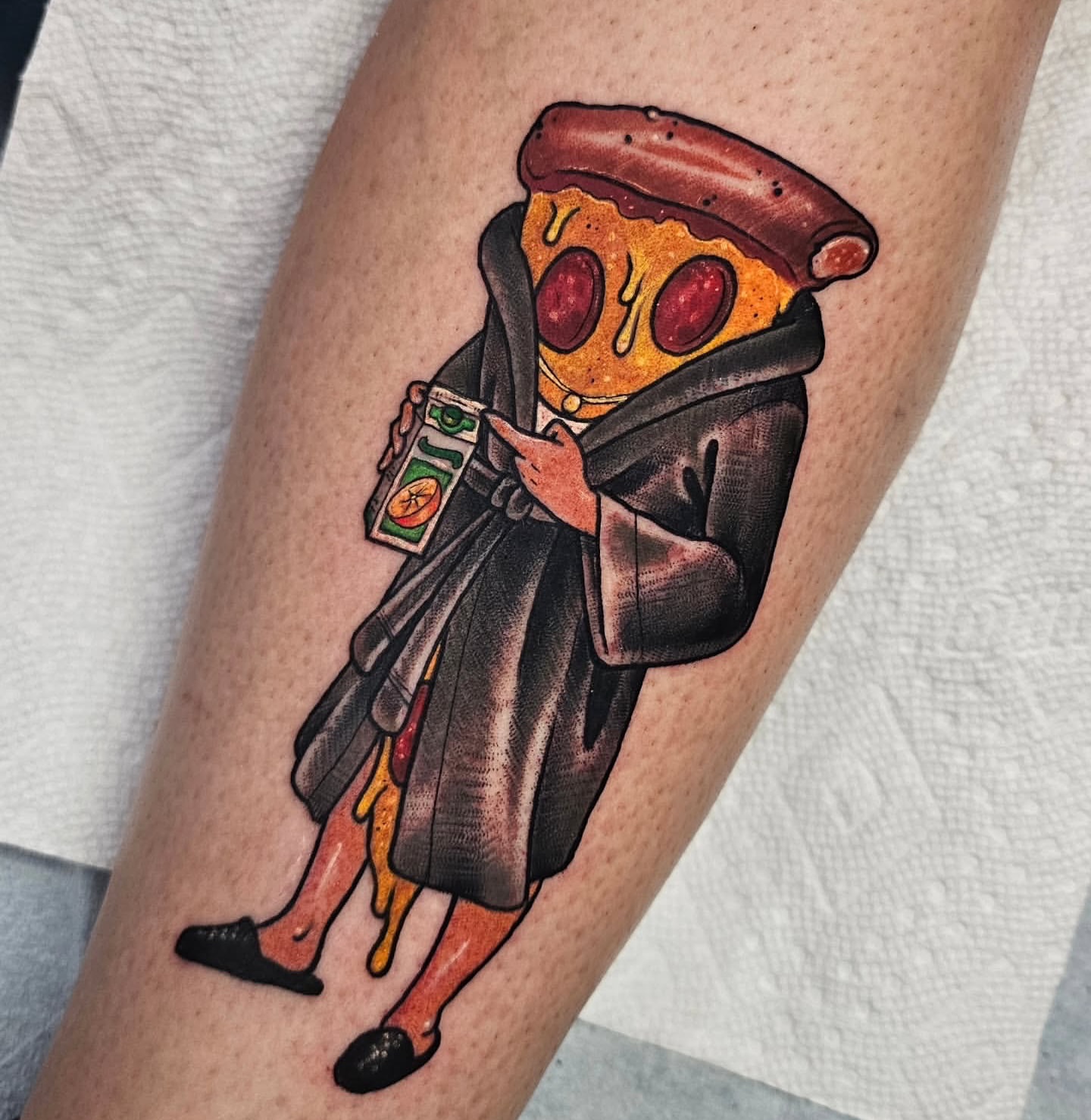 Pizza slice illustrative tattoo on the forearm by Shannon