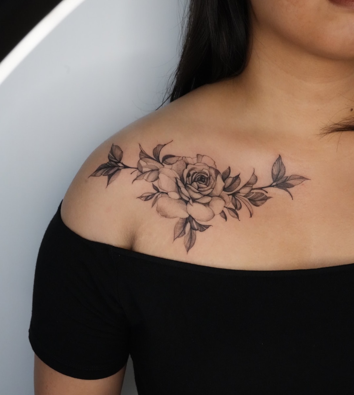 Flowers black and grey tattoo on the shoulder by Blackwork & microrealism tattoos