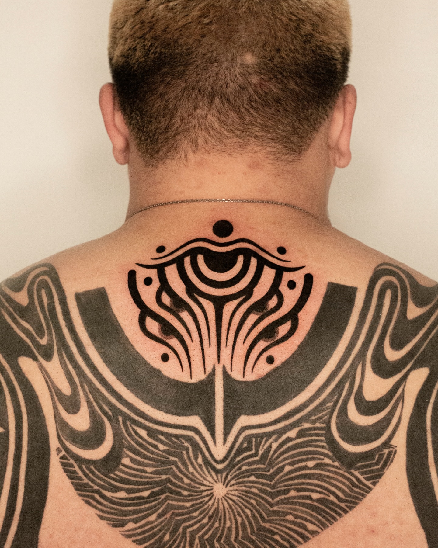 Abstract geometric design geometric tattoo on the back by Fisher Man
