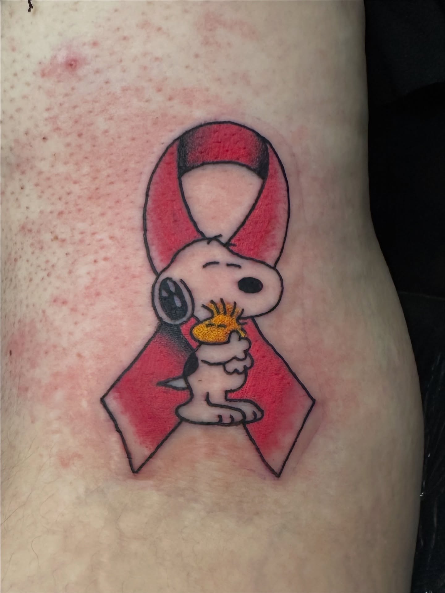 Snoopy and woodstock dotwork tattoo on the thigh by Emily Masa