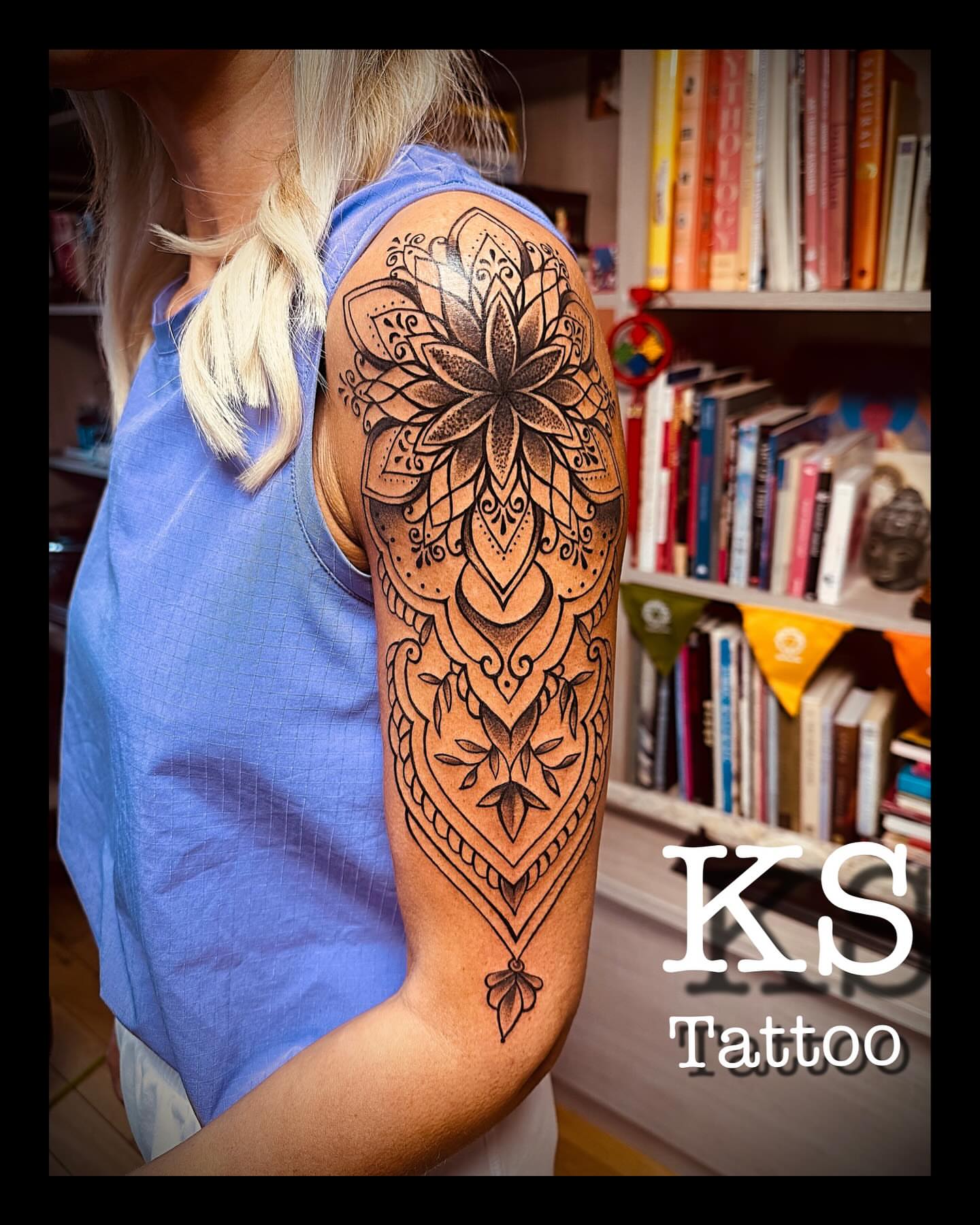 Mandala ornamental tattoo on the upper arm by Karen Smith