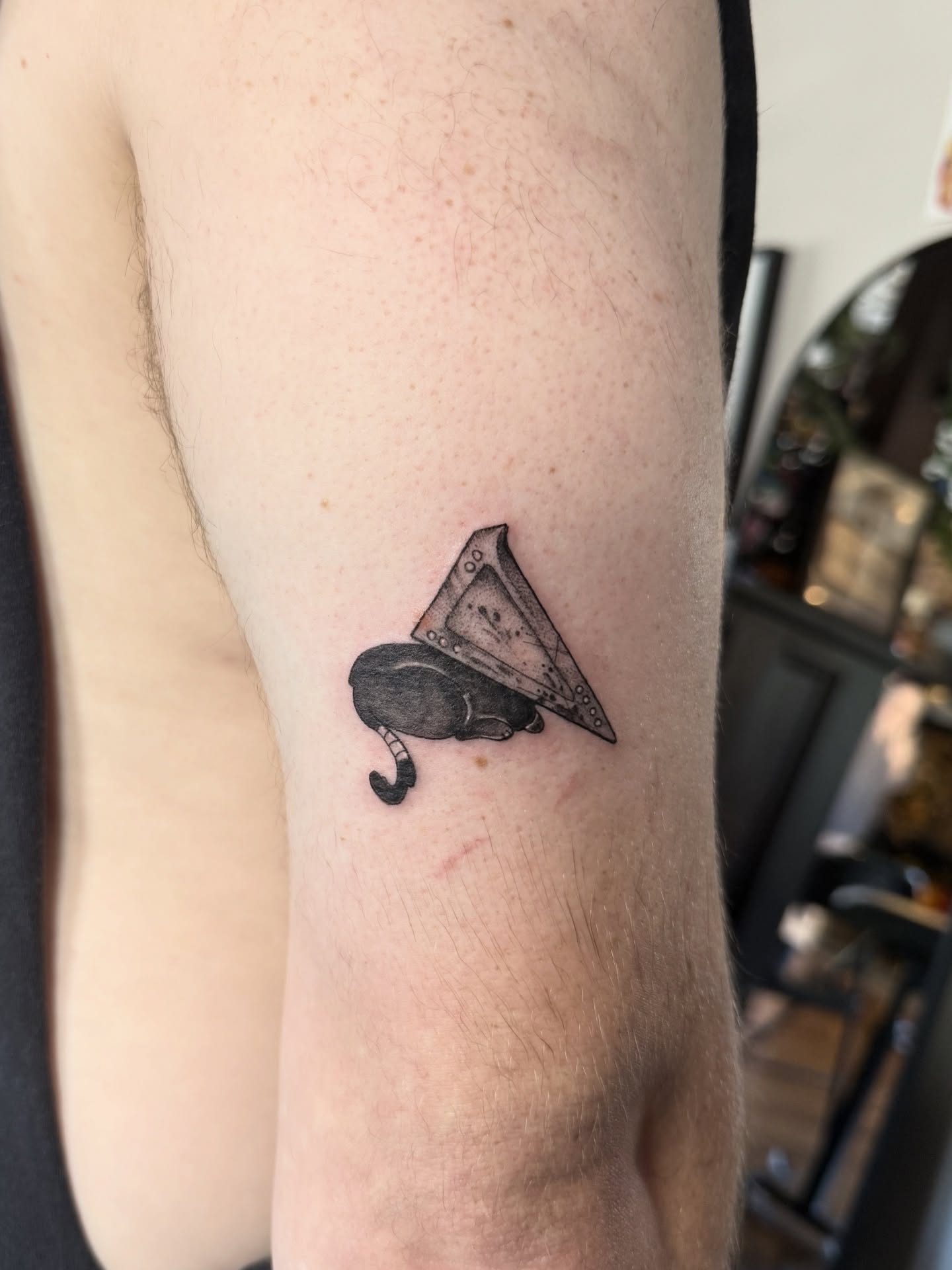 Gramophone black and grey tattoo on the forearm by Jynx