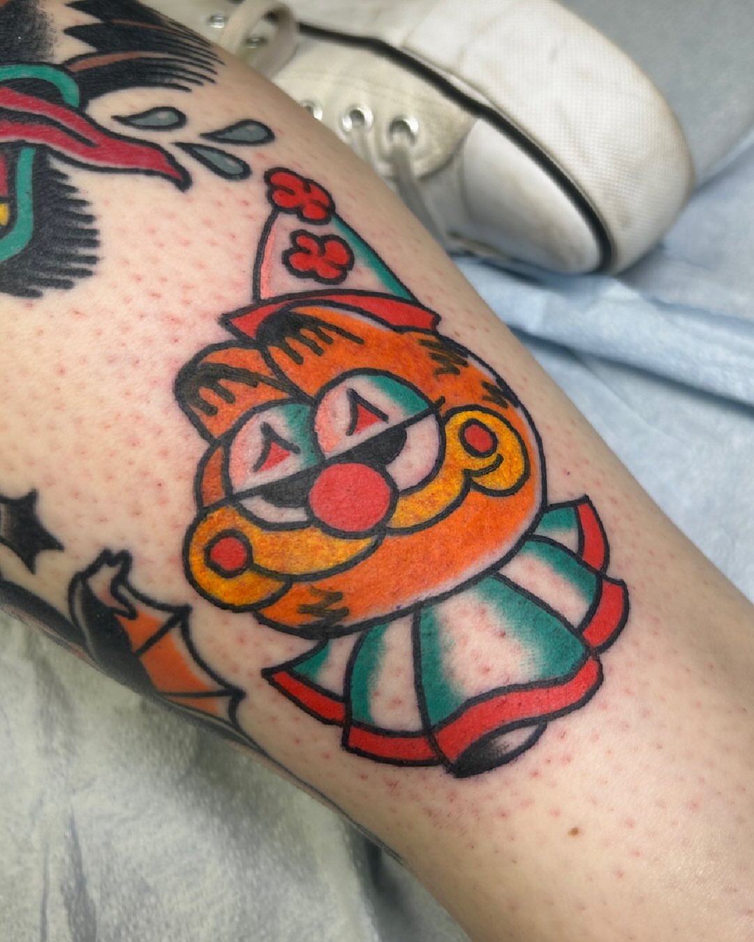 Clown American traditional tattoo on the forearm by Erin Einhorn
