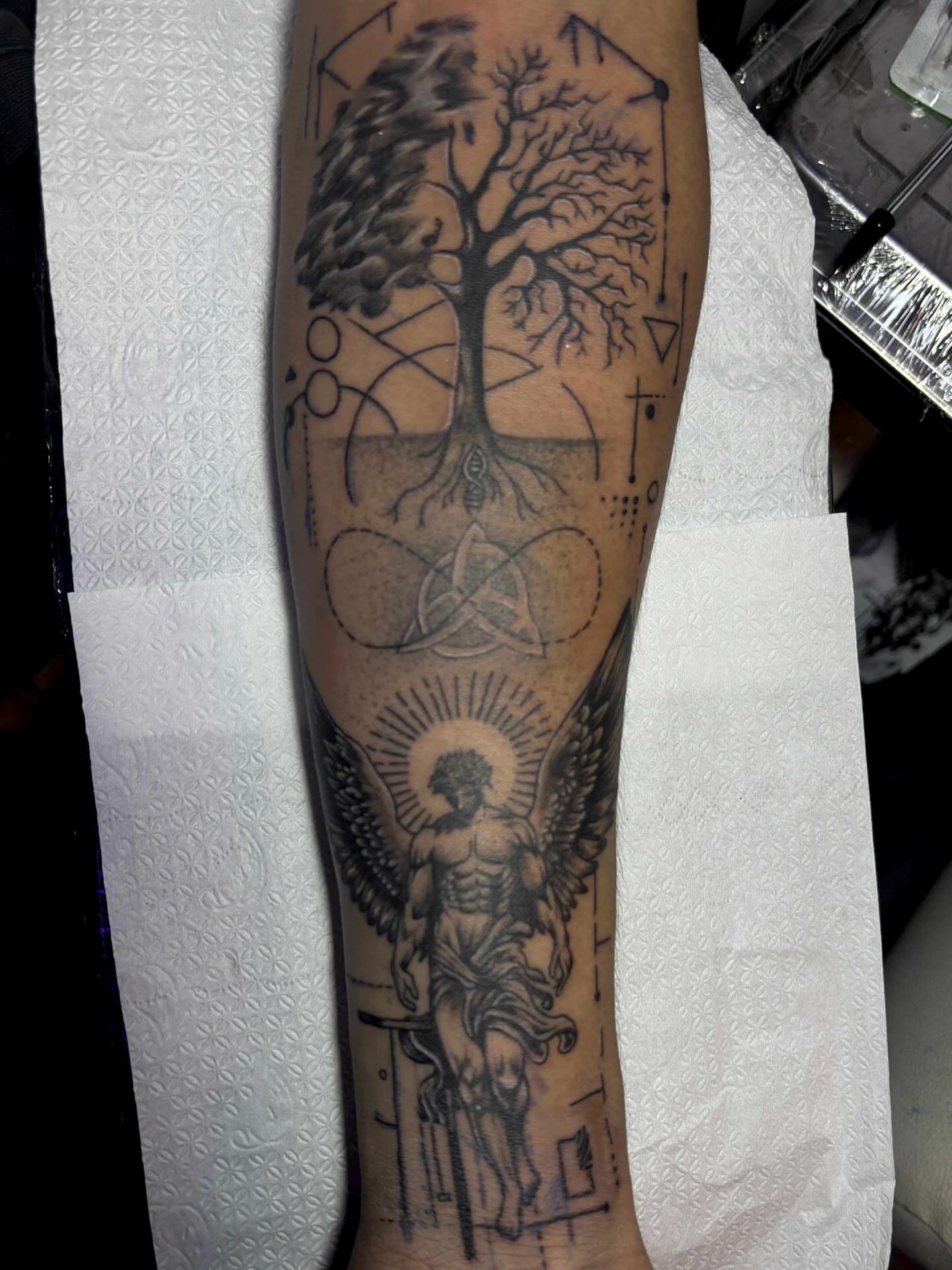 Tree of life with angel geometric tattoo on the calf by Gerd thINK_TATTOO