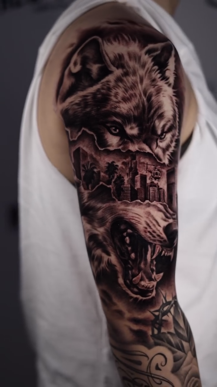 Wolf and city realism tattoo by Anthony Maya