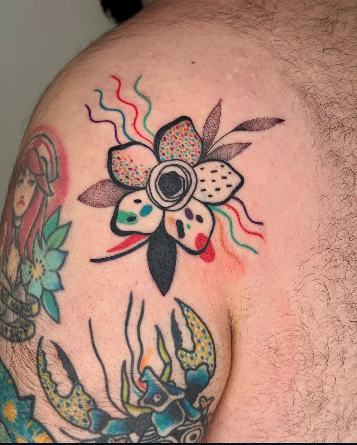 Flower American traditional tattoo on the shoulder by Diana Muresan