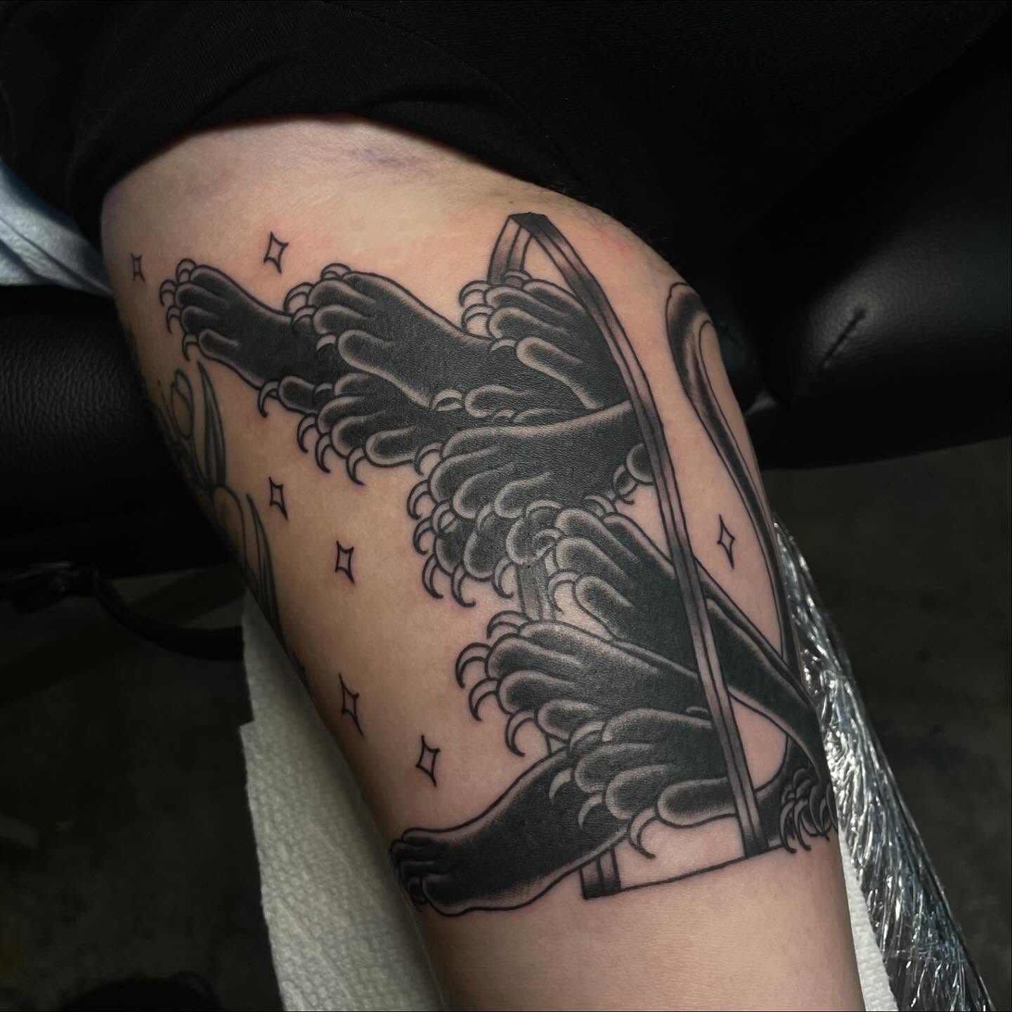 Wings black and grey tattoo on the thigh by Lainy Lou
