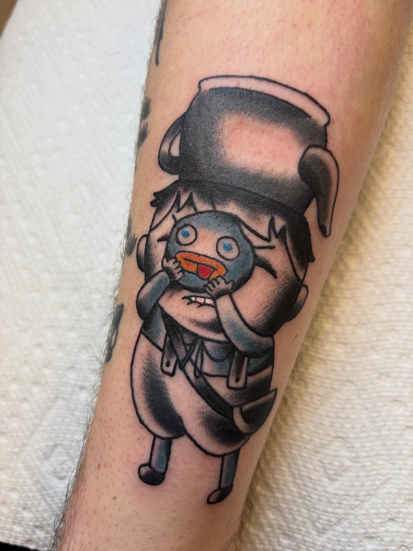 Robotic character black and grey tattoo on the forearm by Ben Whyte