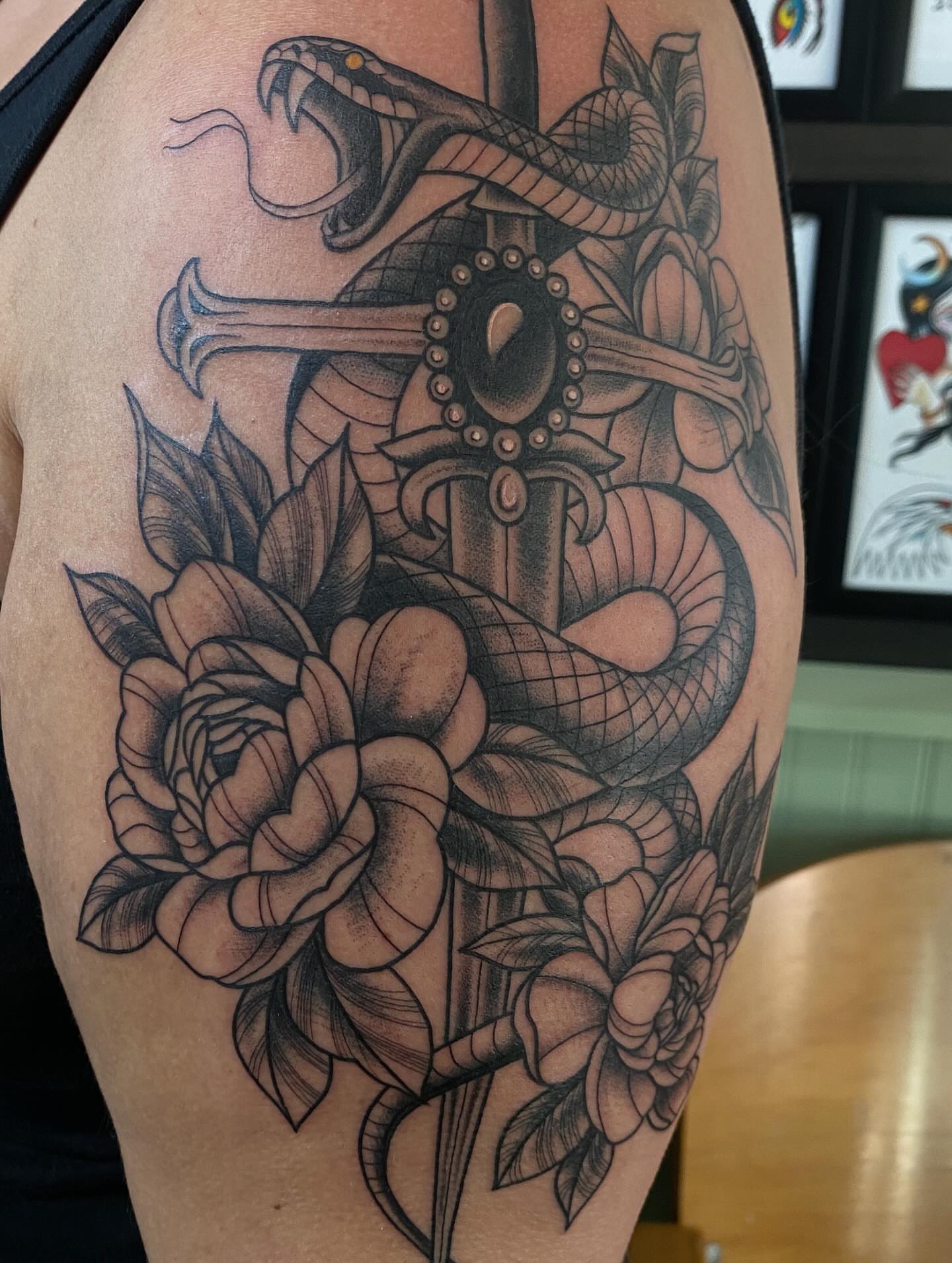 Snake and peony black and grey tattoo on the thigh by Kiera ❤️‍🔥