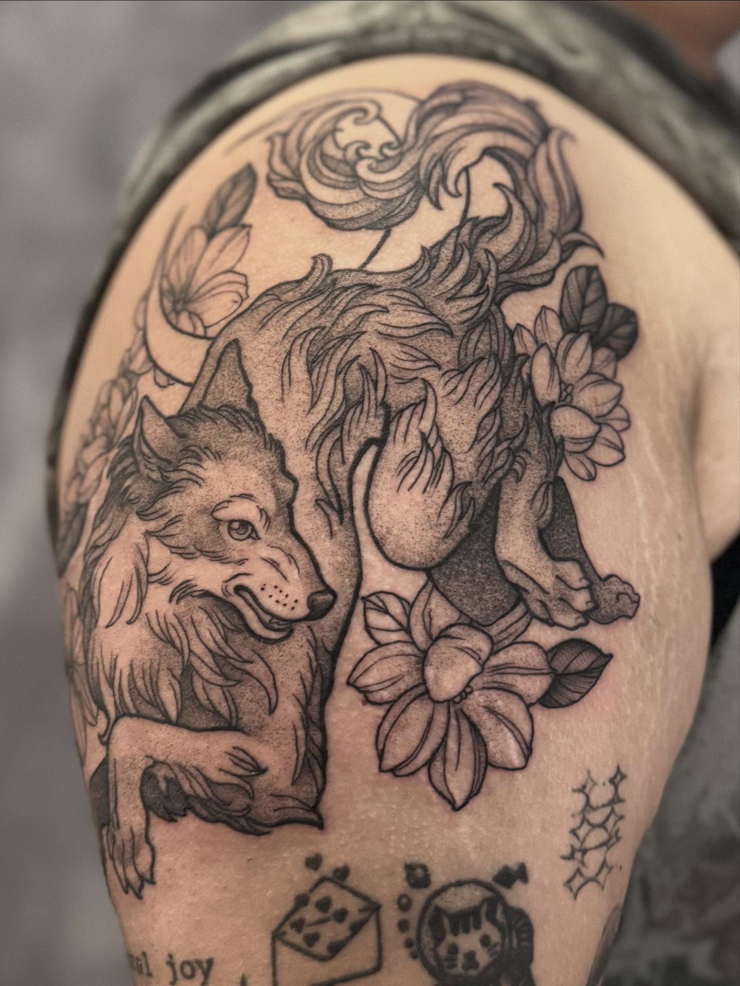 Wolf and flowers black and grey tattoo on the shoulder by Hillary