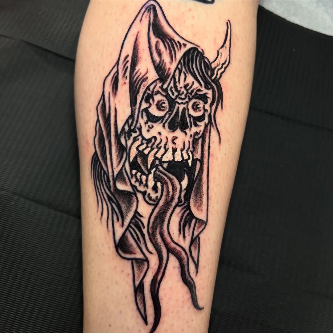 Grim reaper skull with horns dark art tattoo on the forearm by Gabi Elia